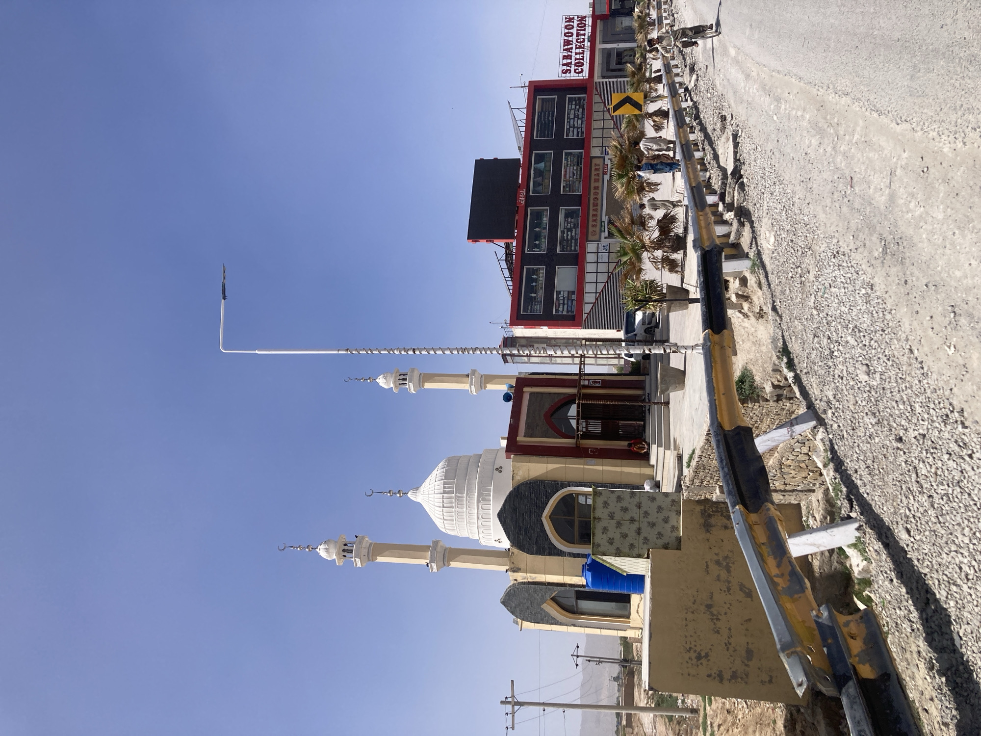 Mosque and commercial buildings captured in Quetta street scene
