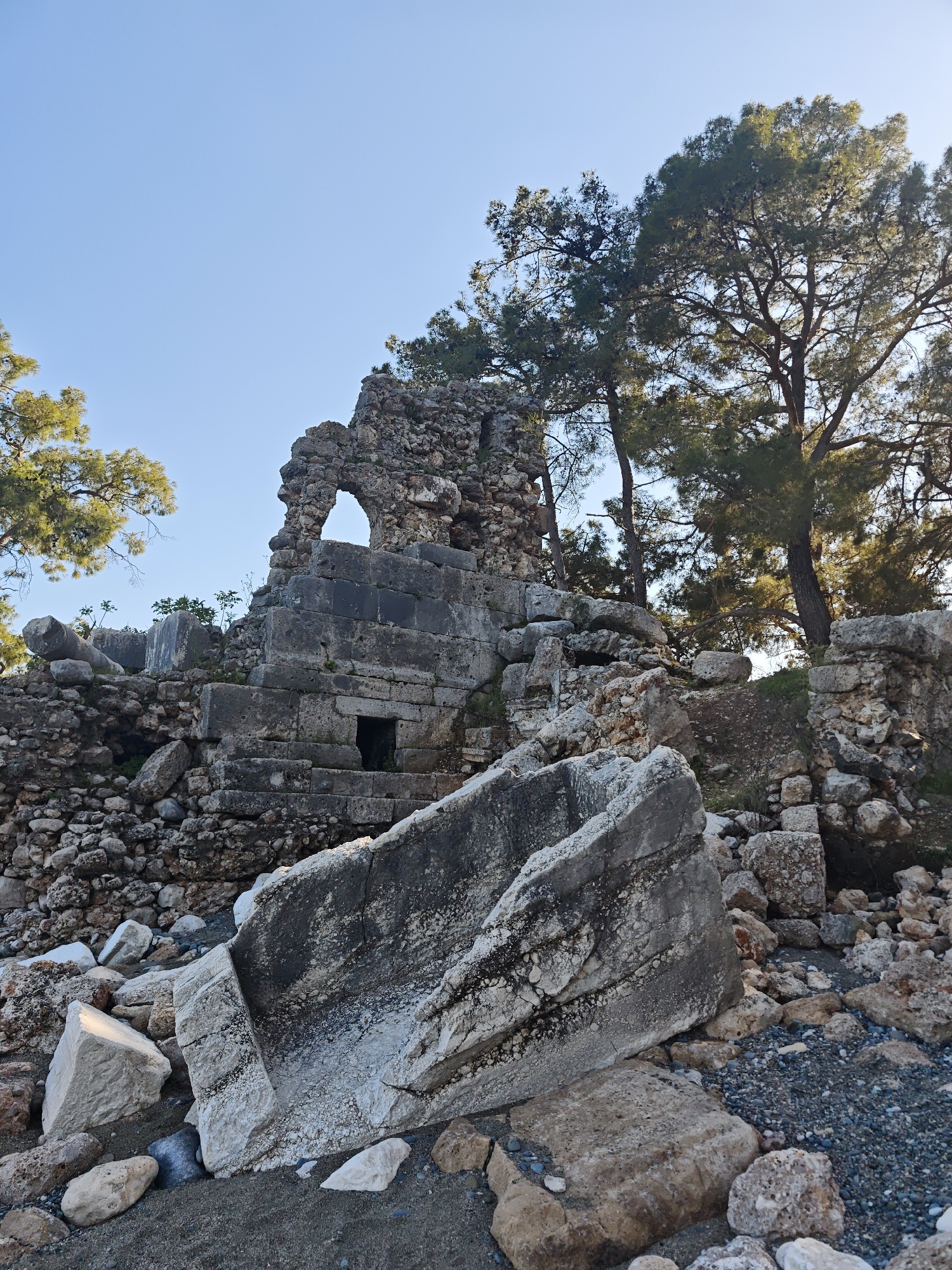 Tourist explores Kemer ruins, beaches, and local art
