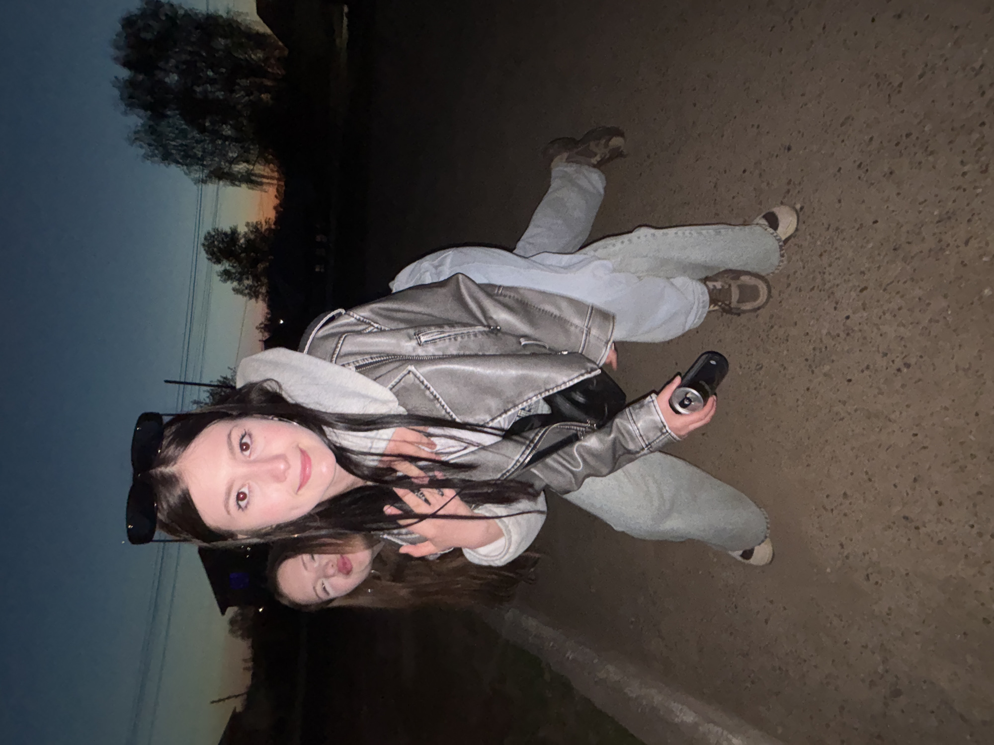 Two women document twilight photo session in Фоки, Russia