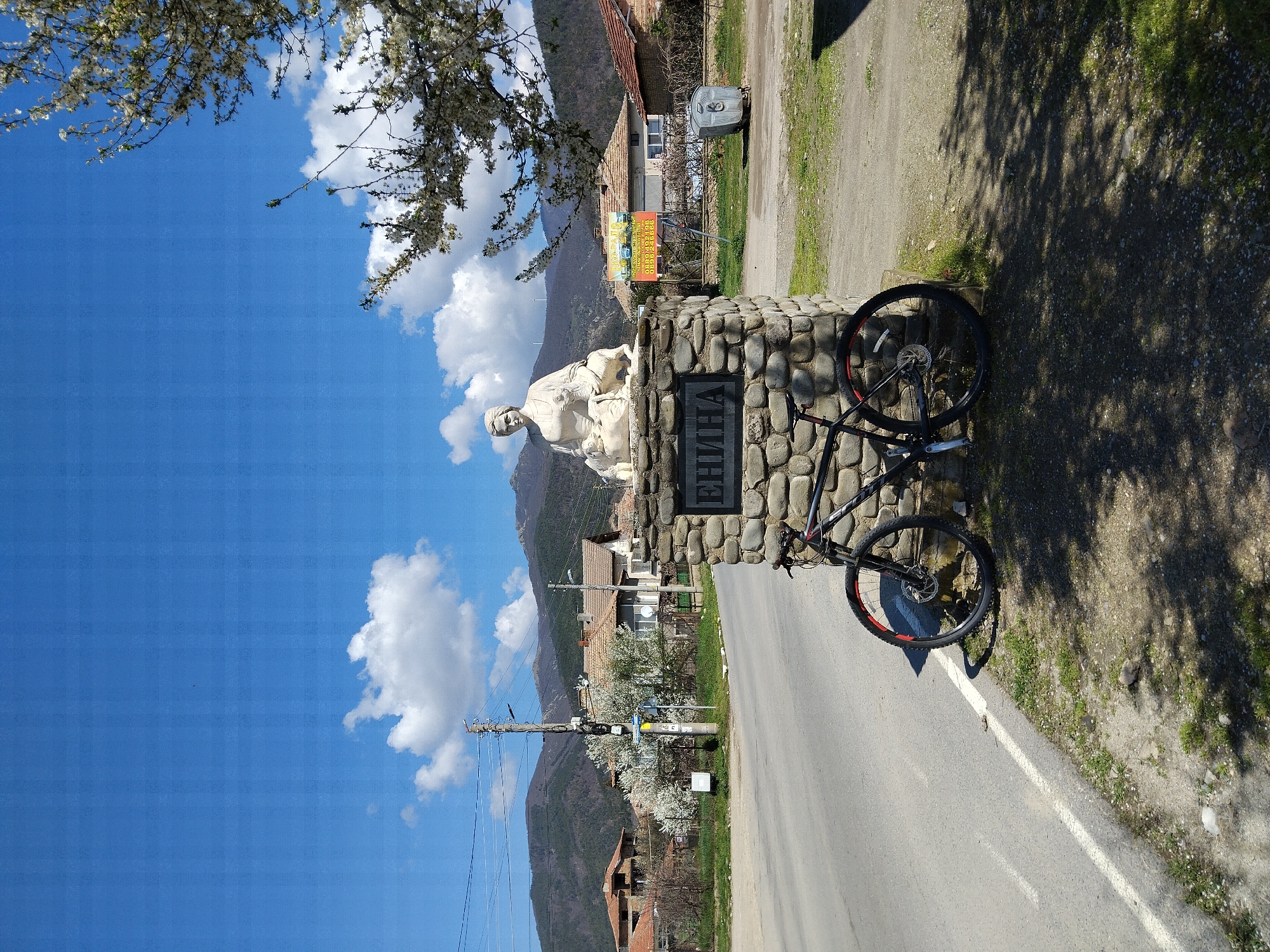 Bicycle spotted against village monument in Kazanlak, Bulgaria