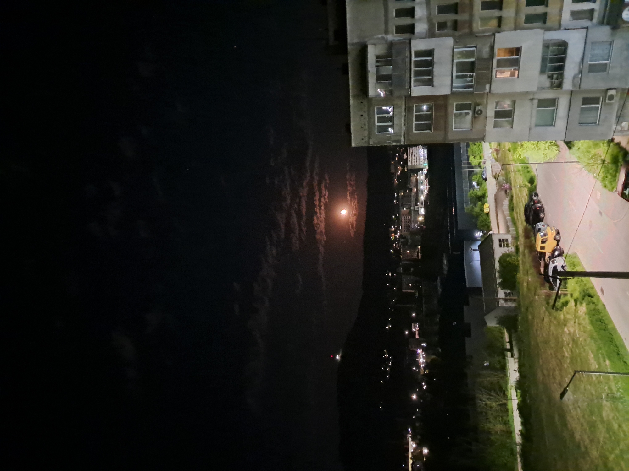 Moon visible through clouds over Gabrovo city lights