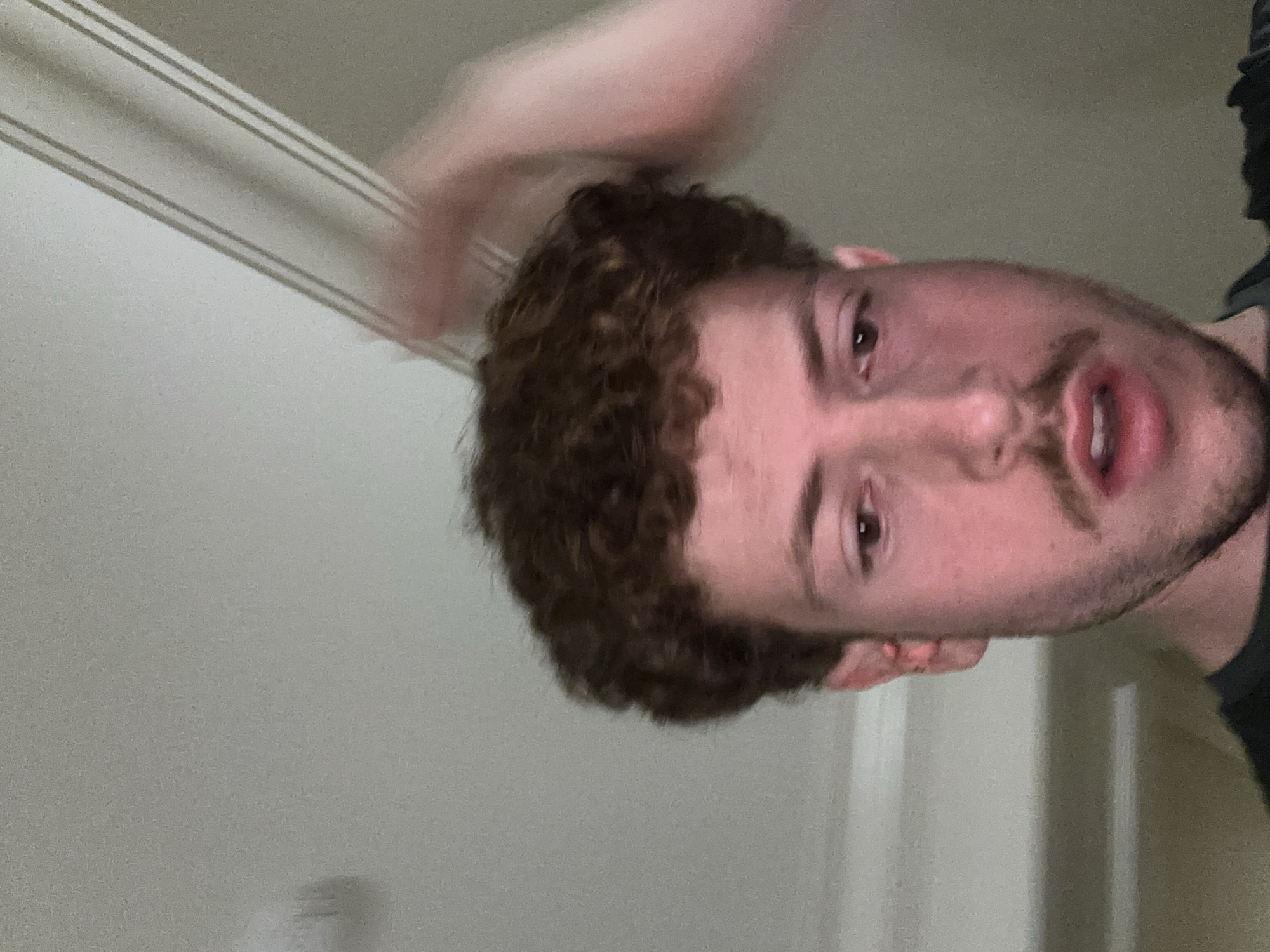 Man with curly hair observed in Aventura, Florida
