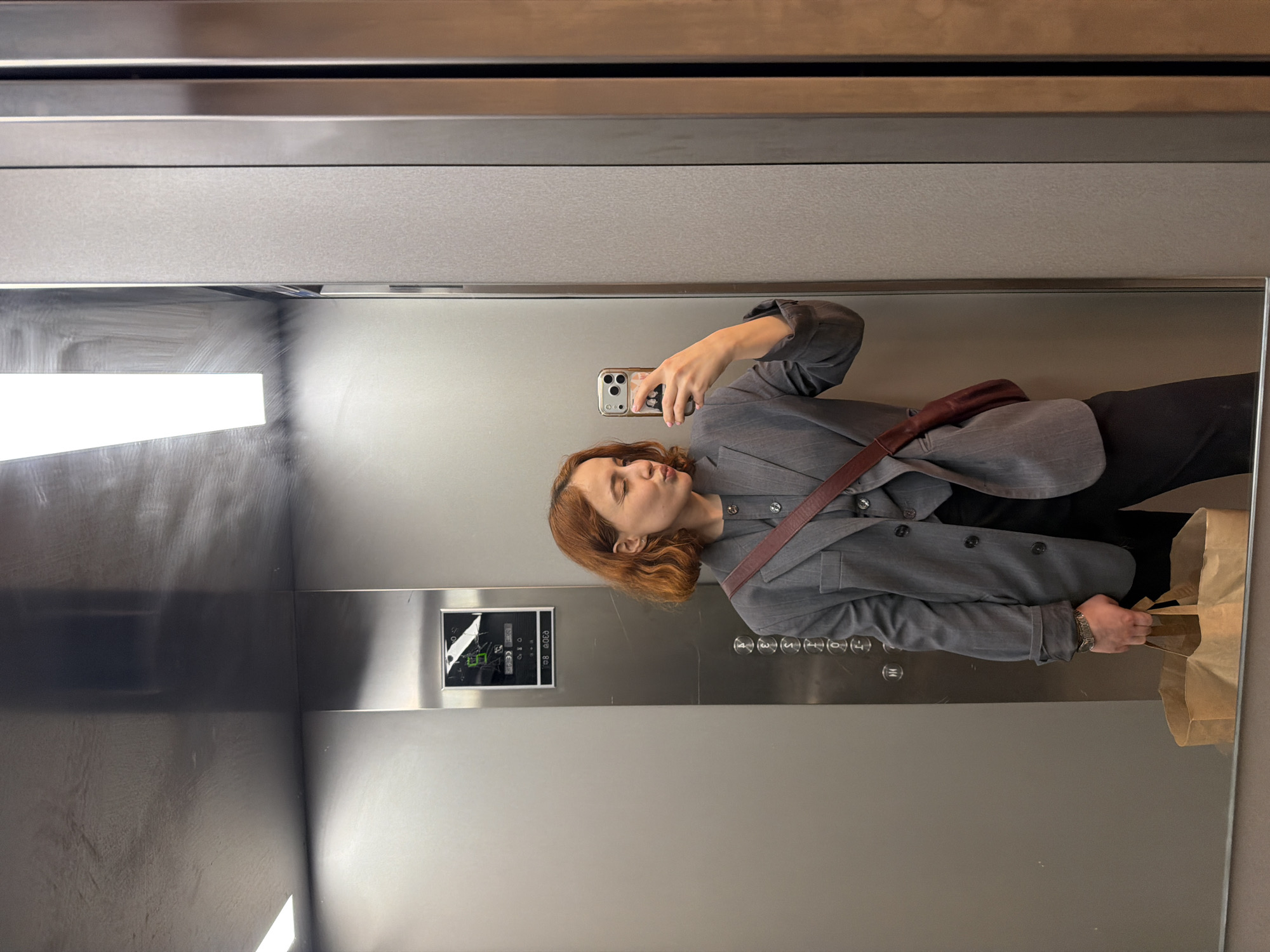 Woman takes elevator selfie in Strasbourg