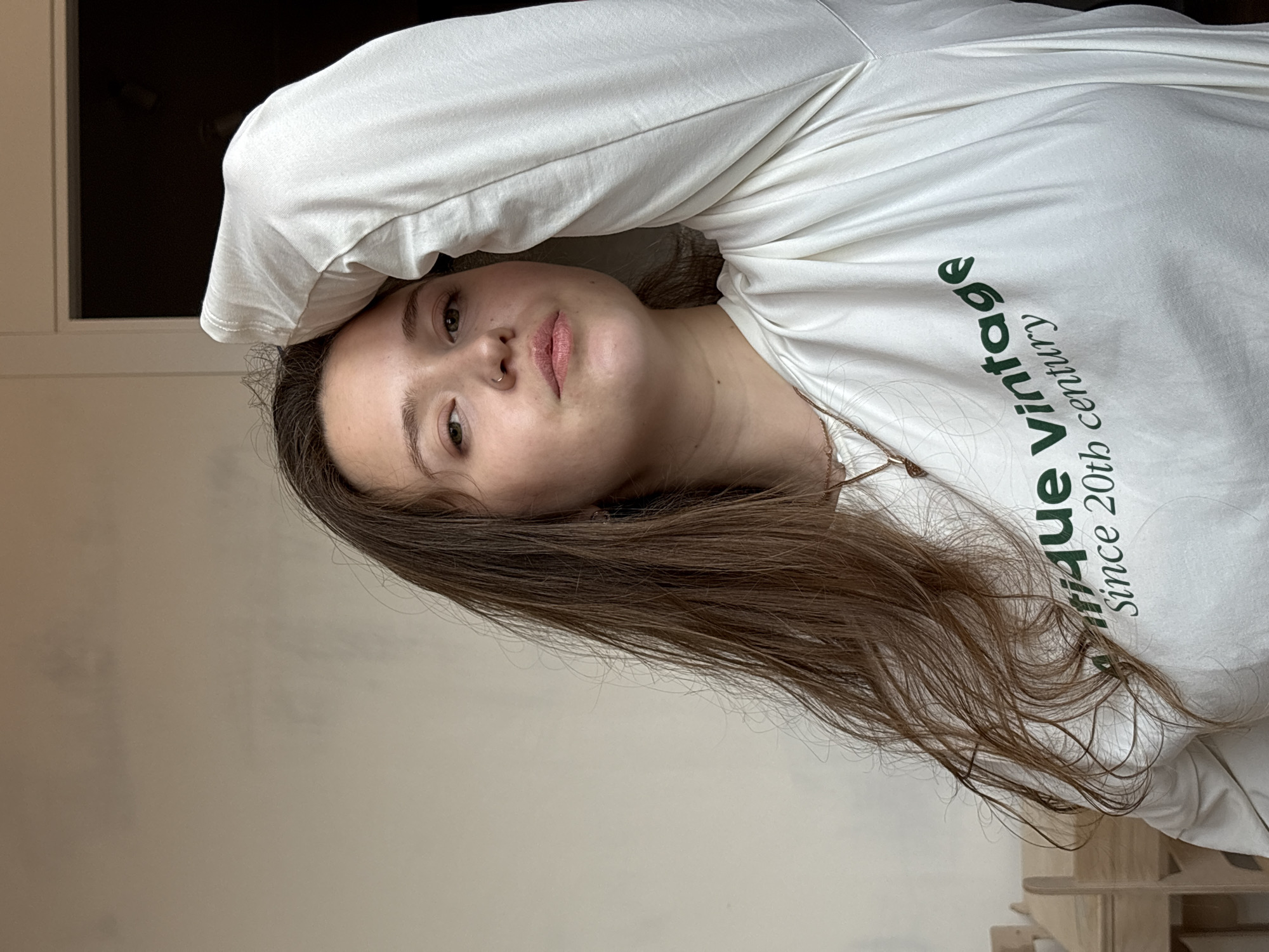 Woman in vintage shirt photographed indoors in Izhevsk