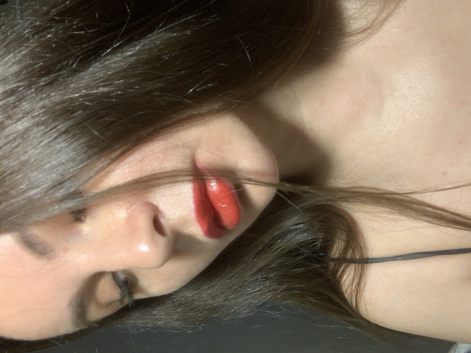 Woman documents red lipstick application for #kissChallenge social media content