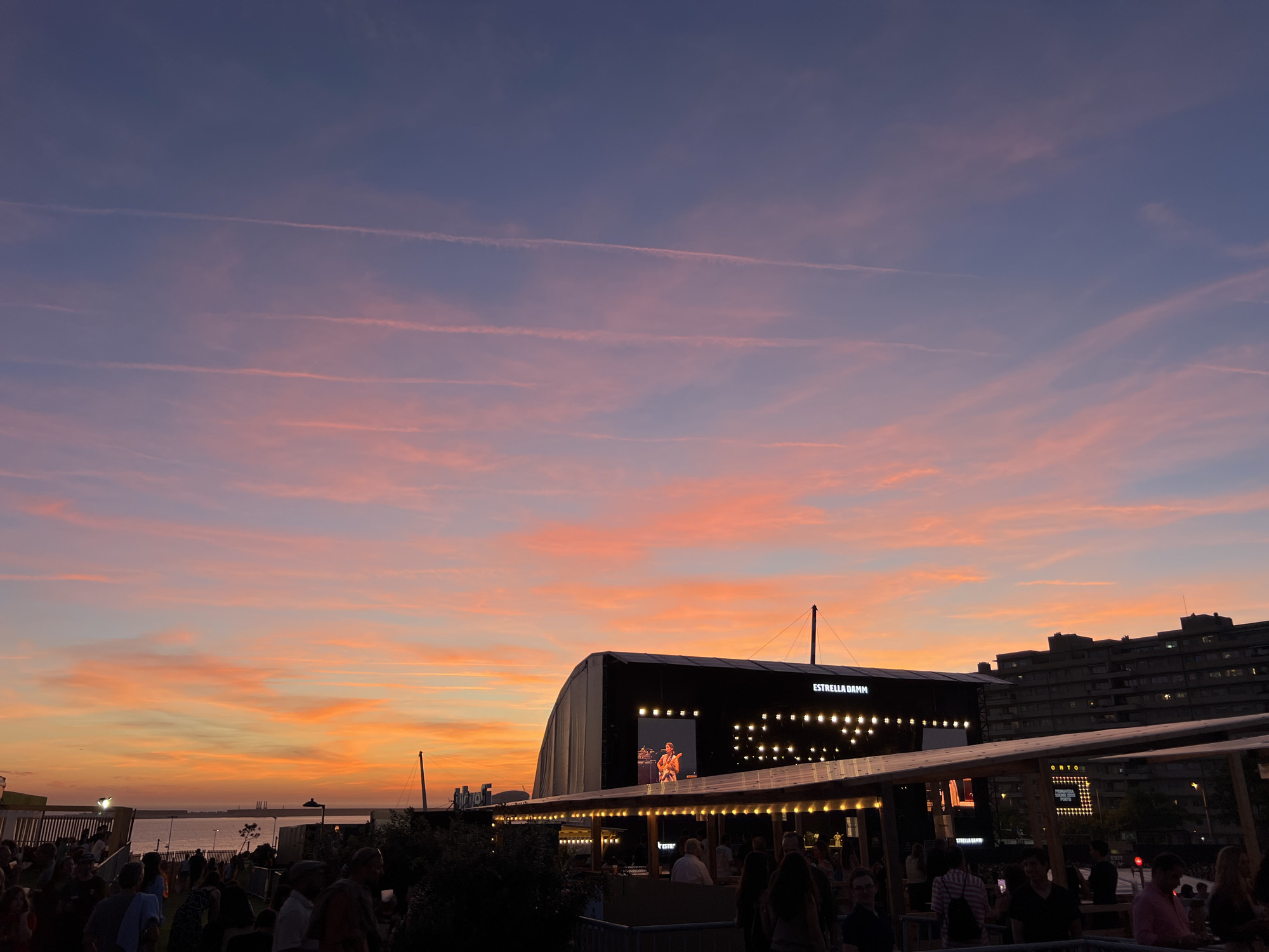 Outdoor concert venue captures vibrant sunset in Porto