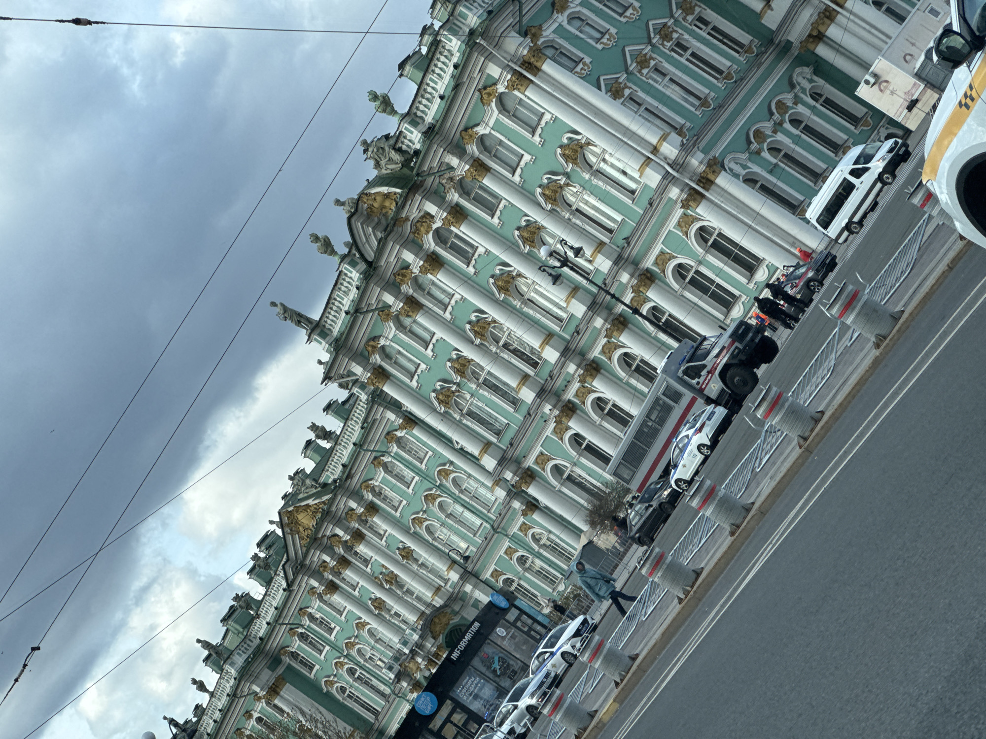 Tourist documents Winter Palace and Admiralty landmarks in Saint Petersburg