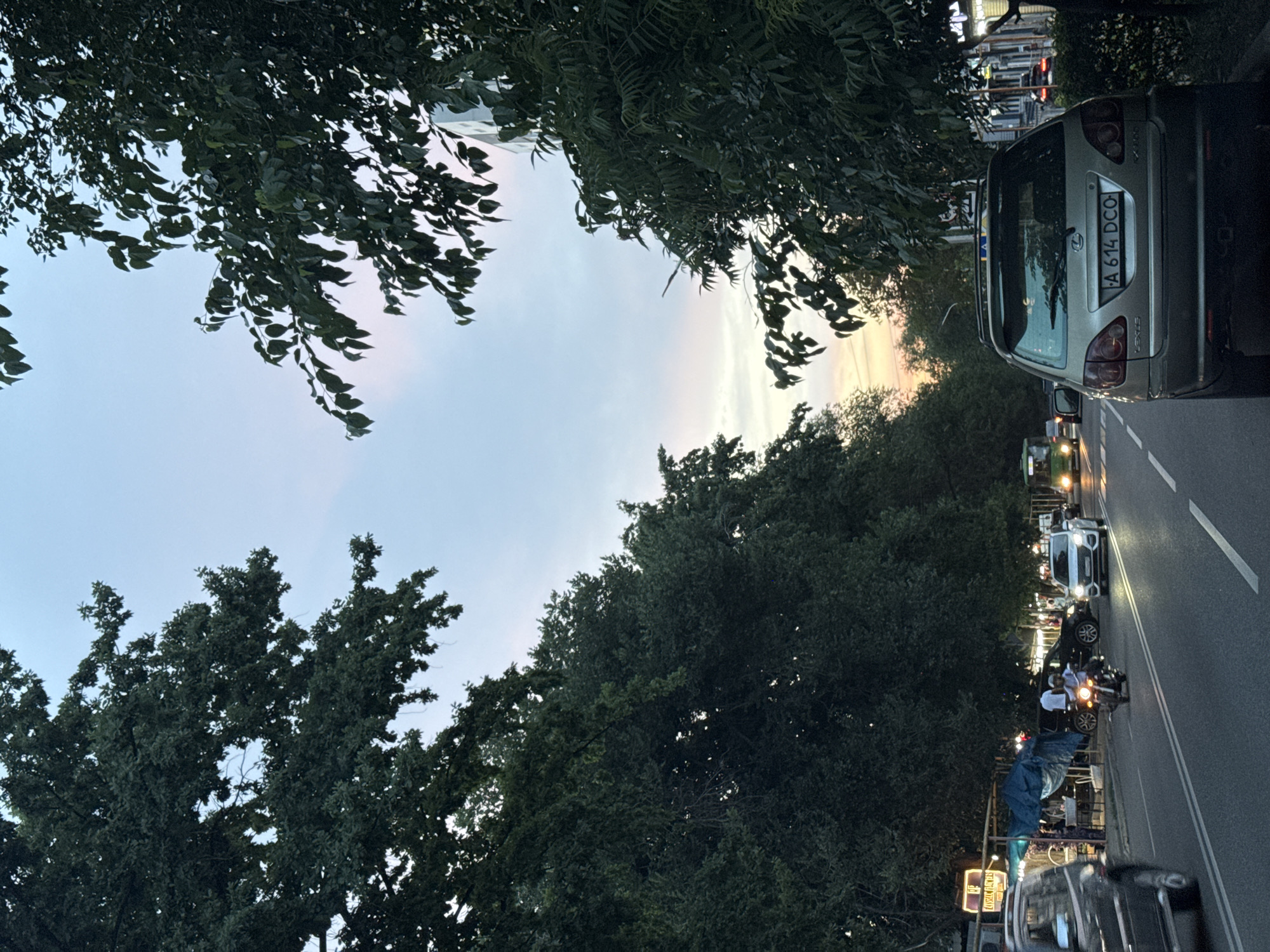 Evening drive through Almaty streets, captured from inside a Kia