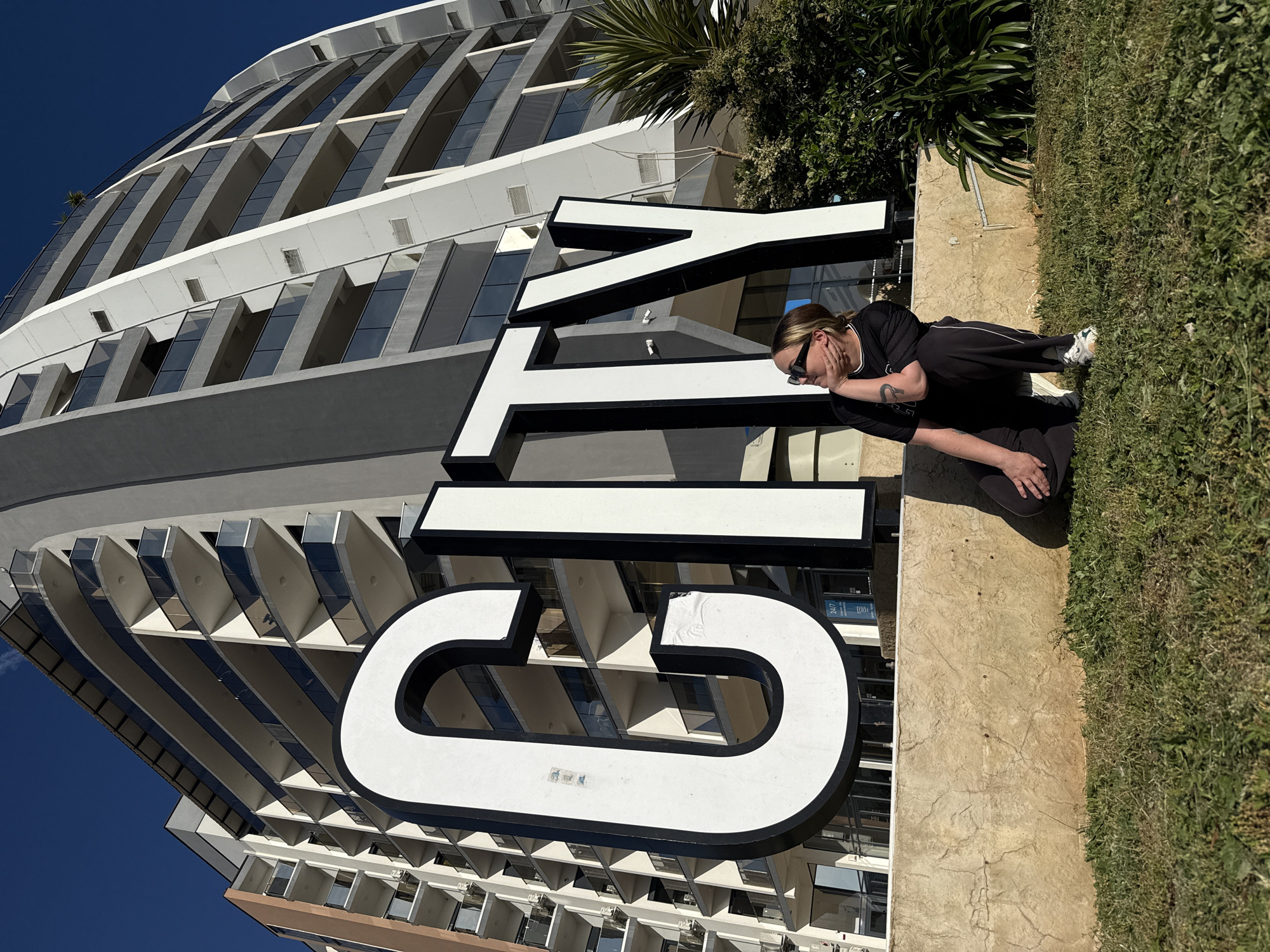 Tourists pose with letter sculptures in Bar, Montenegro