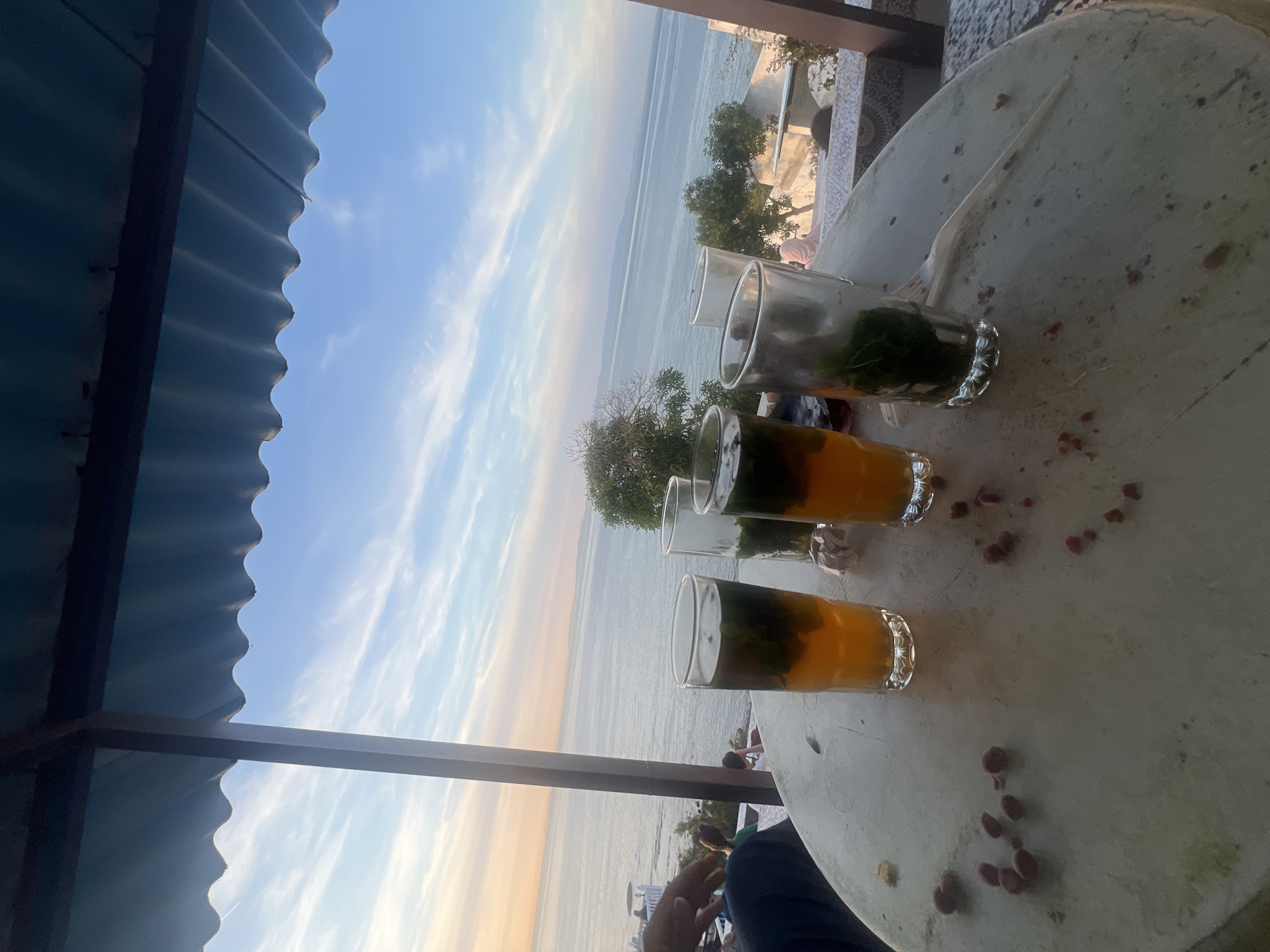 Sunset mint tea gathering captured at Tangier coastal cafes