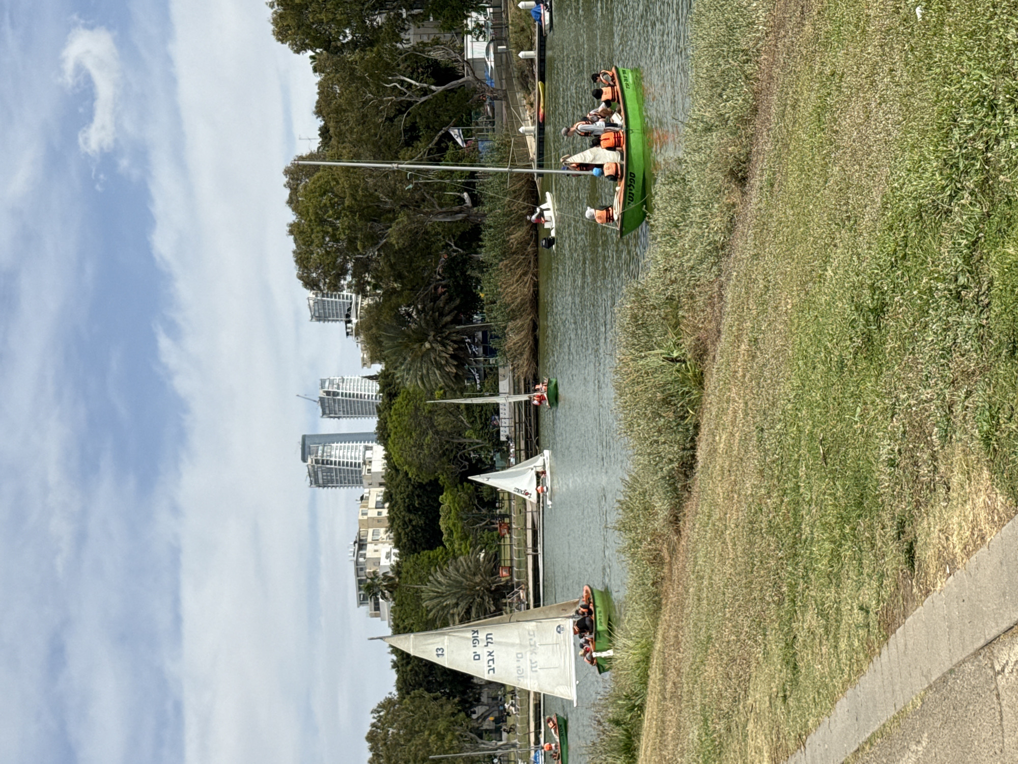 Recreational boats with passengers cruise Yarkon River in Tel Aviv