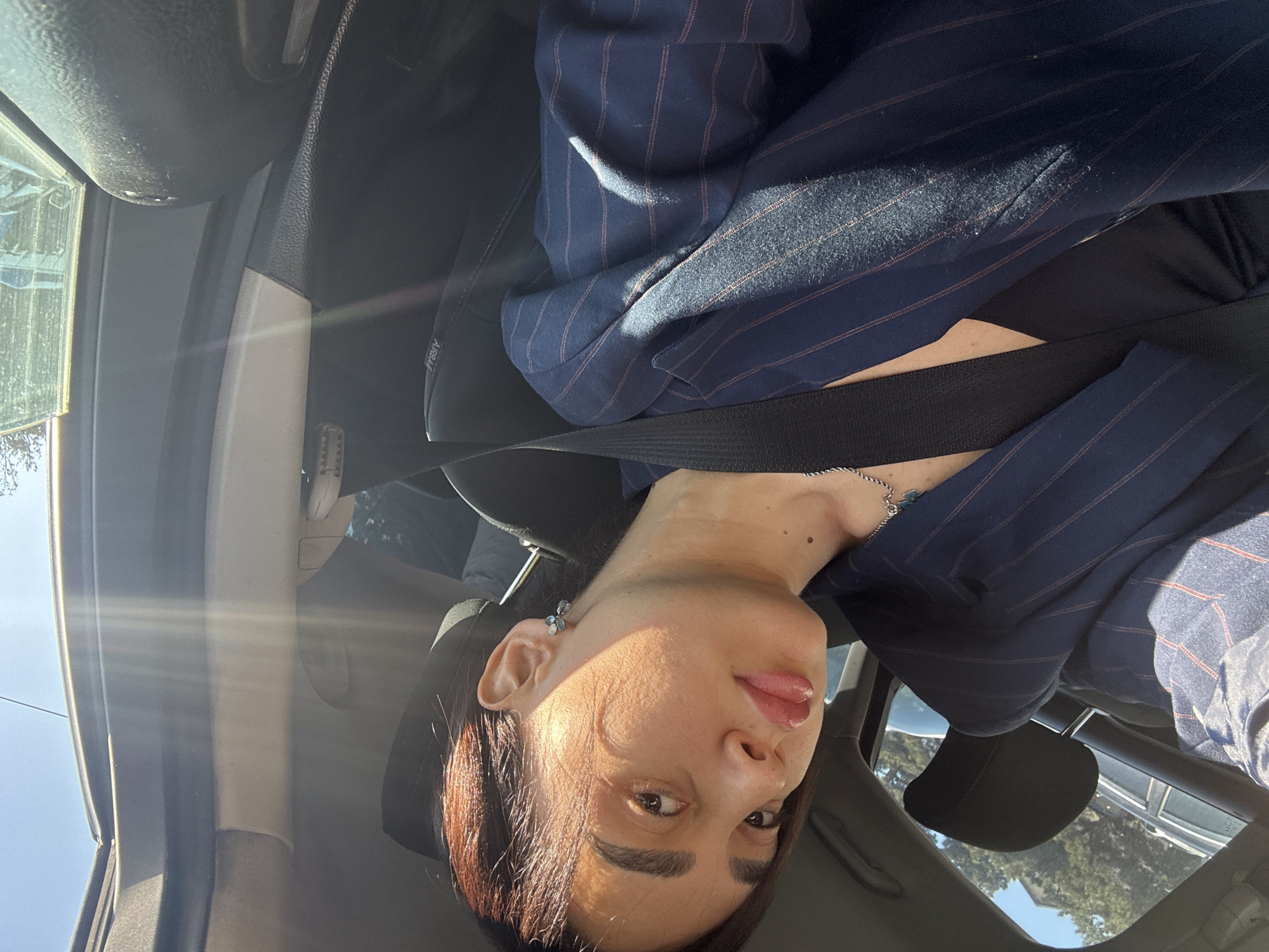 Woman takes car selfies in Tbilisi parking lot