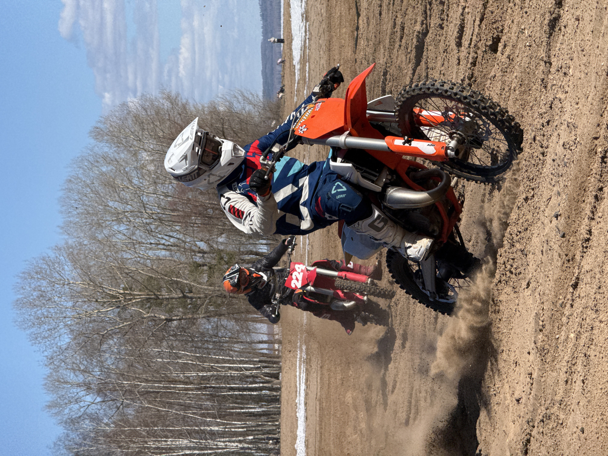 Motocross riders race on sandy tracks in Noviy, Russia