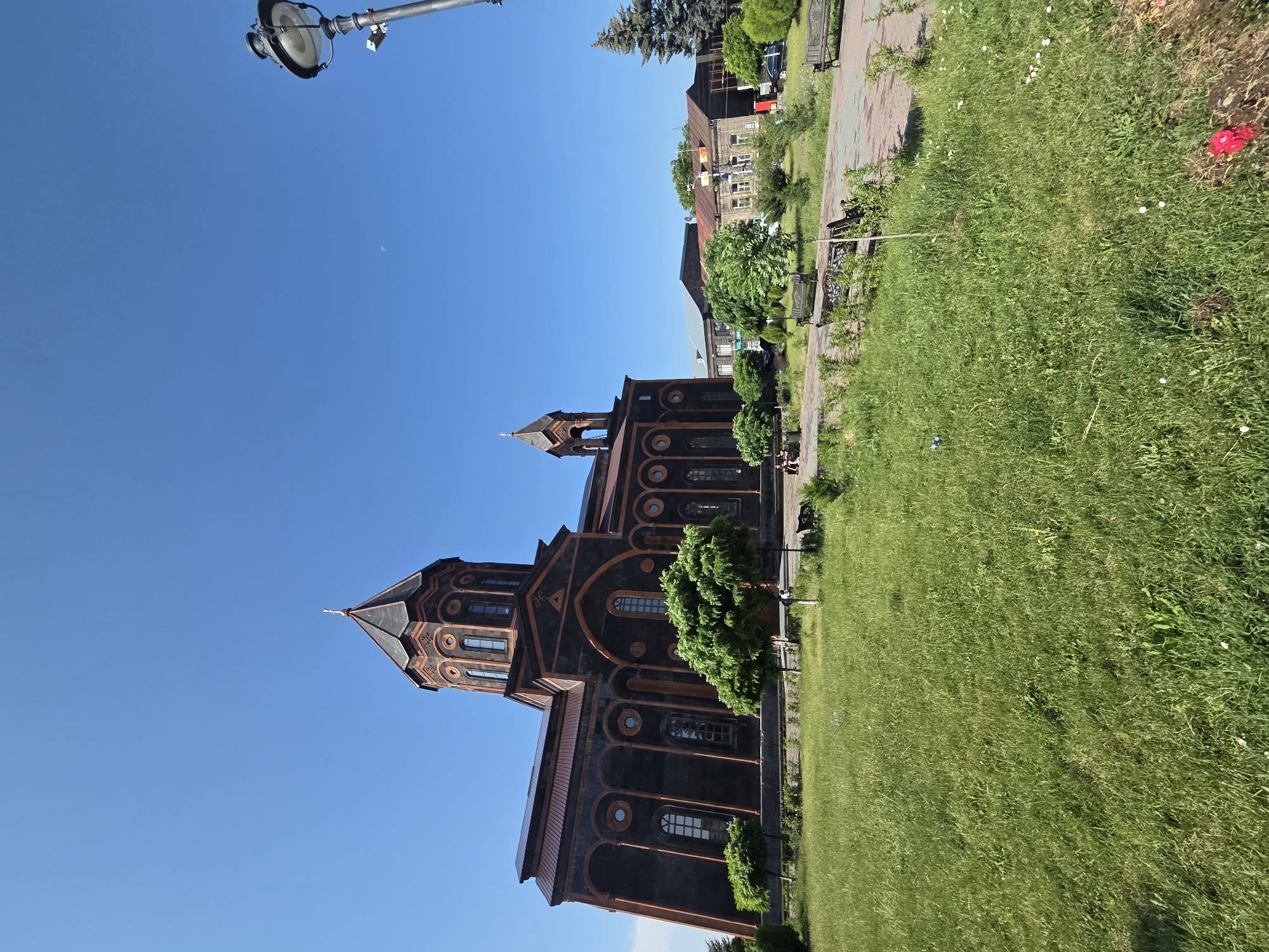 Dark-stone domed church in a Gyumri park