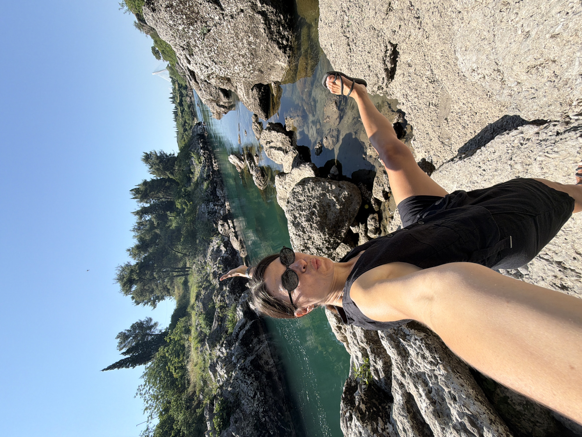 Woman photographs morning river visit in Podgorica Montenegro