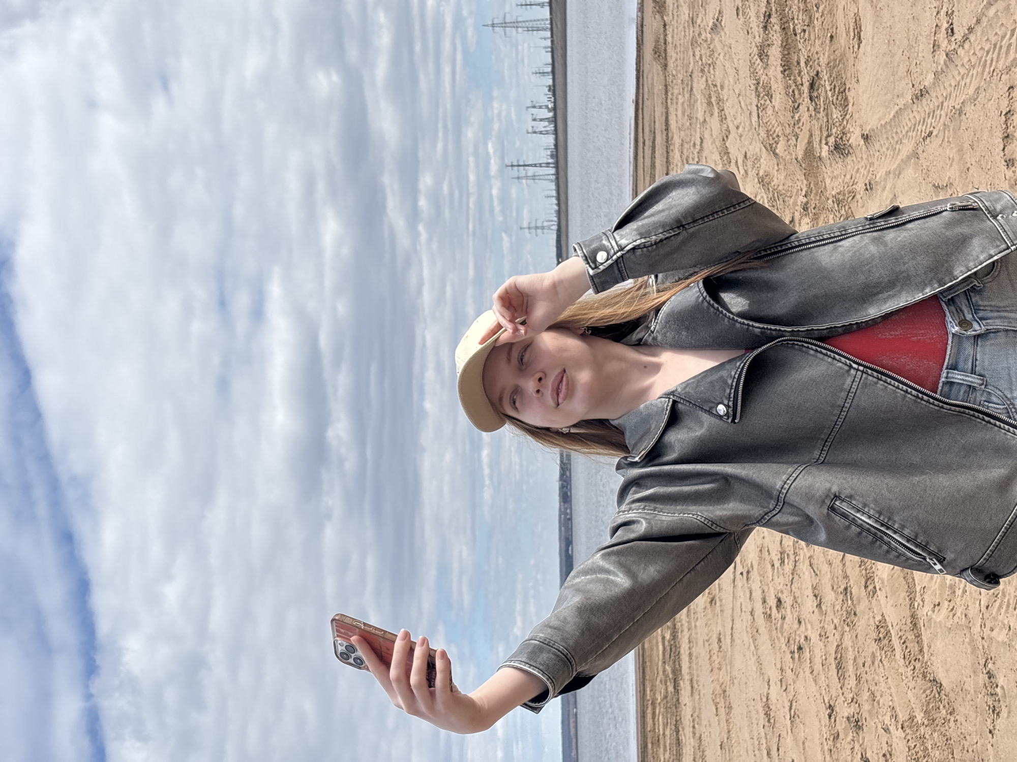Young people gather for beach photos and socializing in Noviy