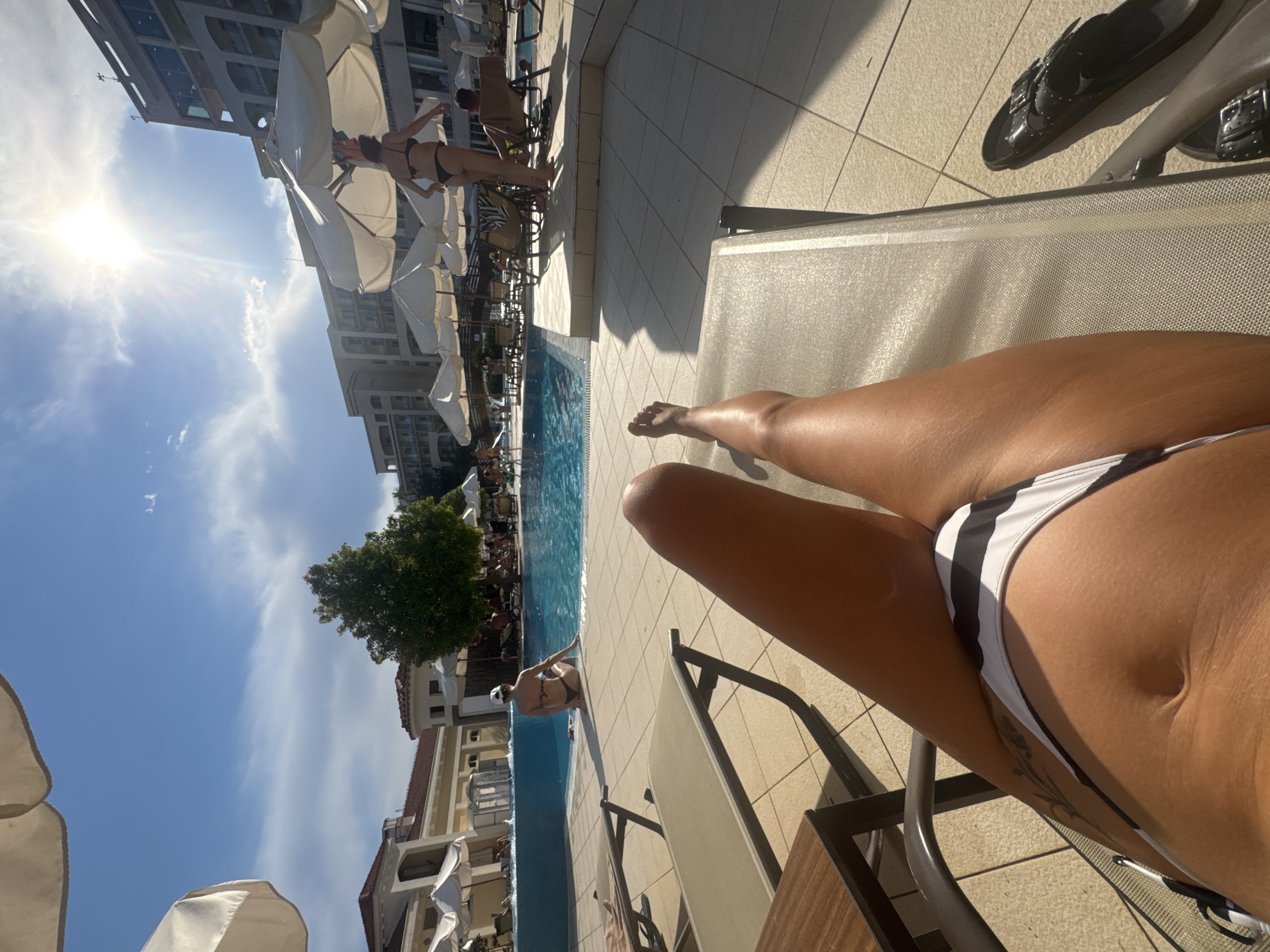 Lazy afternoon at a Boreti resort pool, sun and swimming