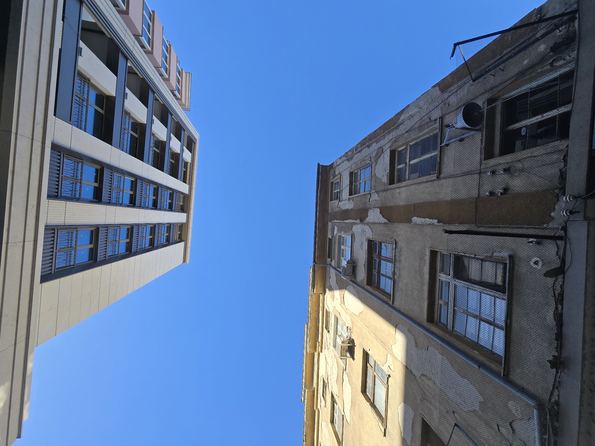 Urban documentation captures buildings, eagle statue, and #Build signage