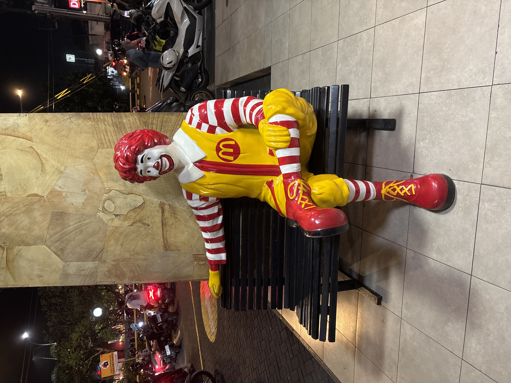 Ronald McDonald statue spotted on bench in Kuta Selatan