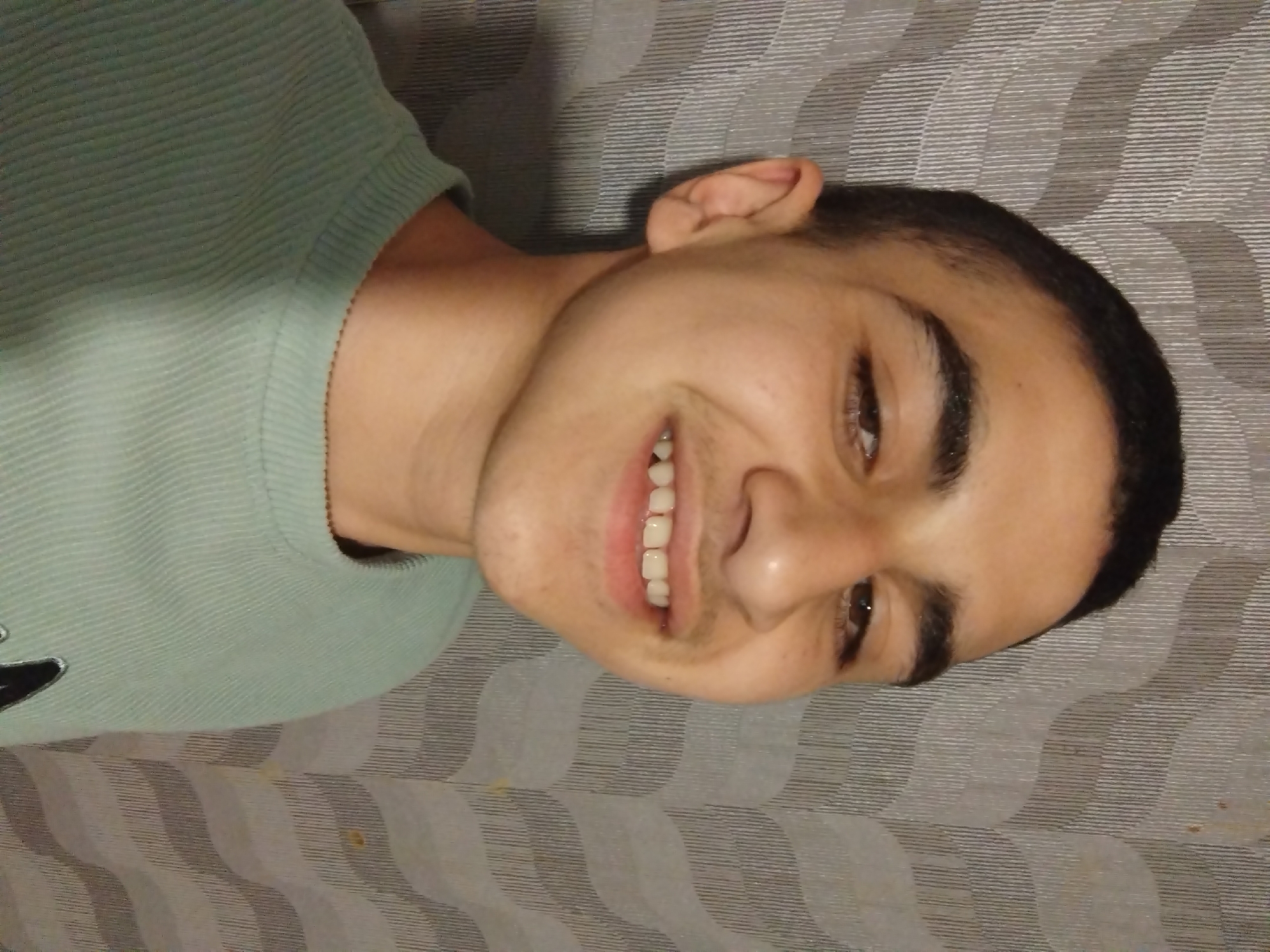Young man photographed smiling in Pleven, Bulgaria