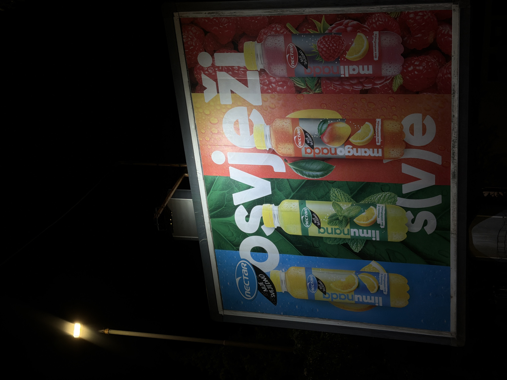 Illuminated juice billboard spotted in Podgorica at night