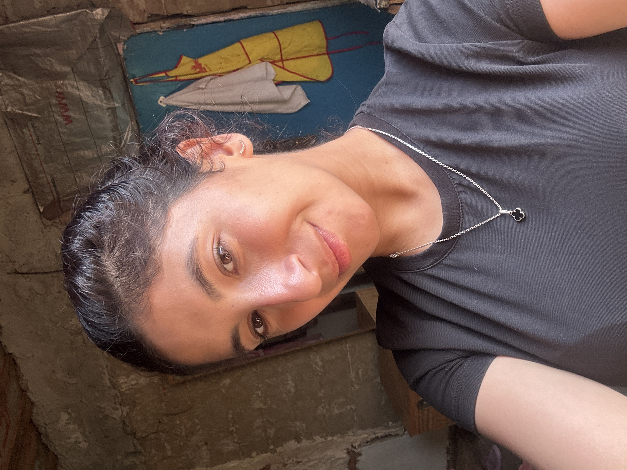 Quick selfie session against a grey wall in Dondukovskaya
