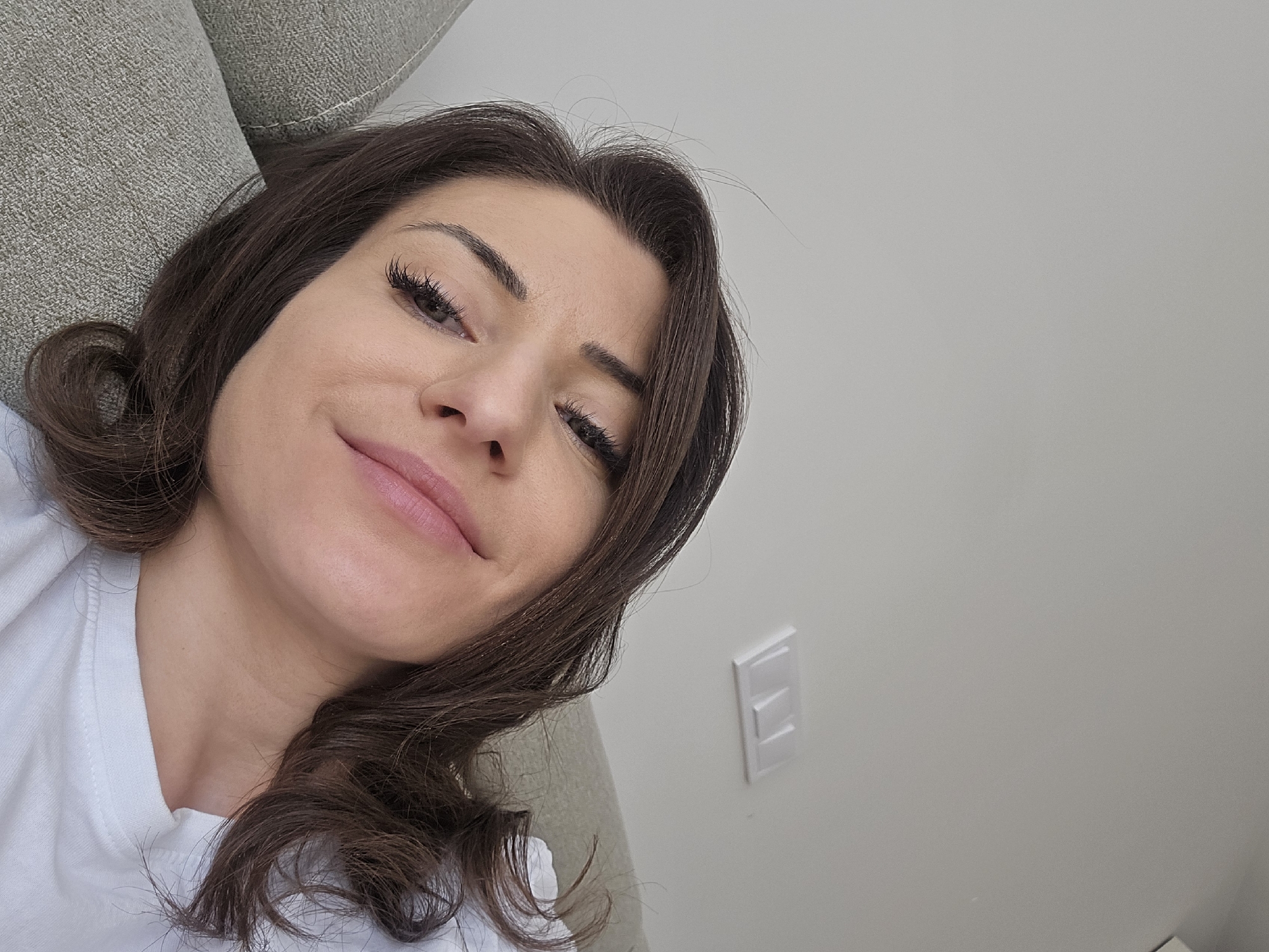 Woman takes selfie on couch in Sofia