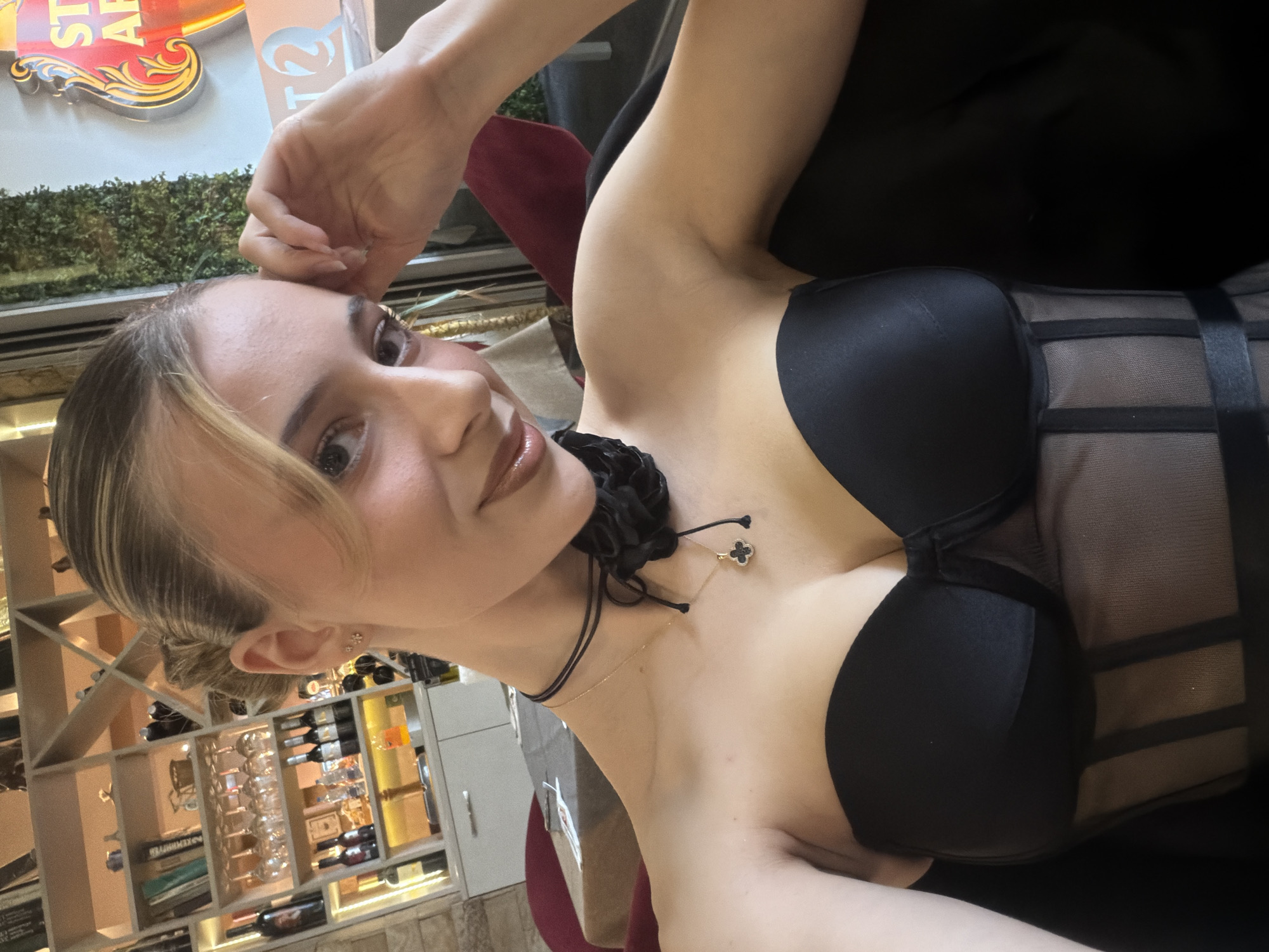 Woman takes selfies at Plovdiv restaurant with companion