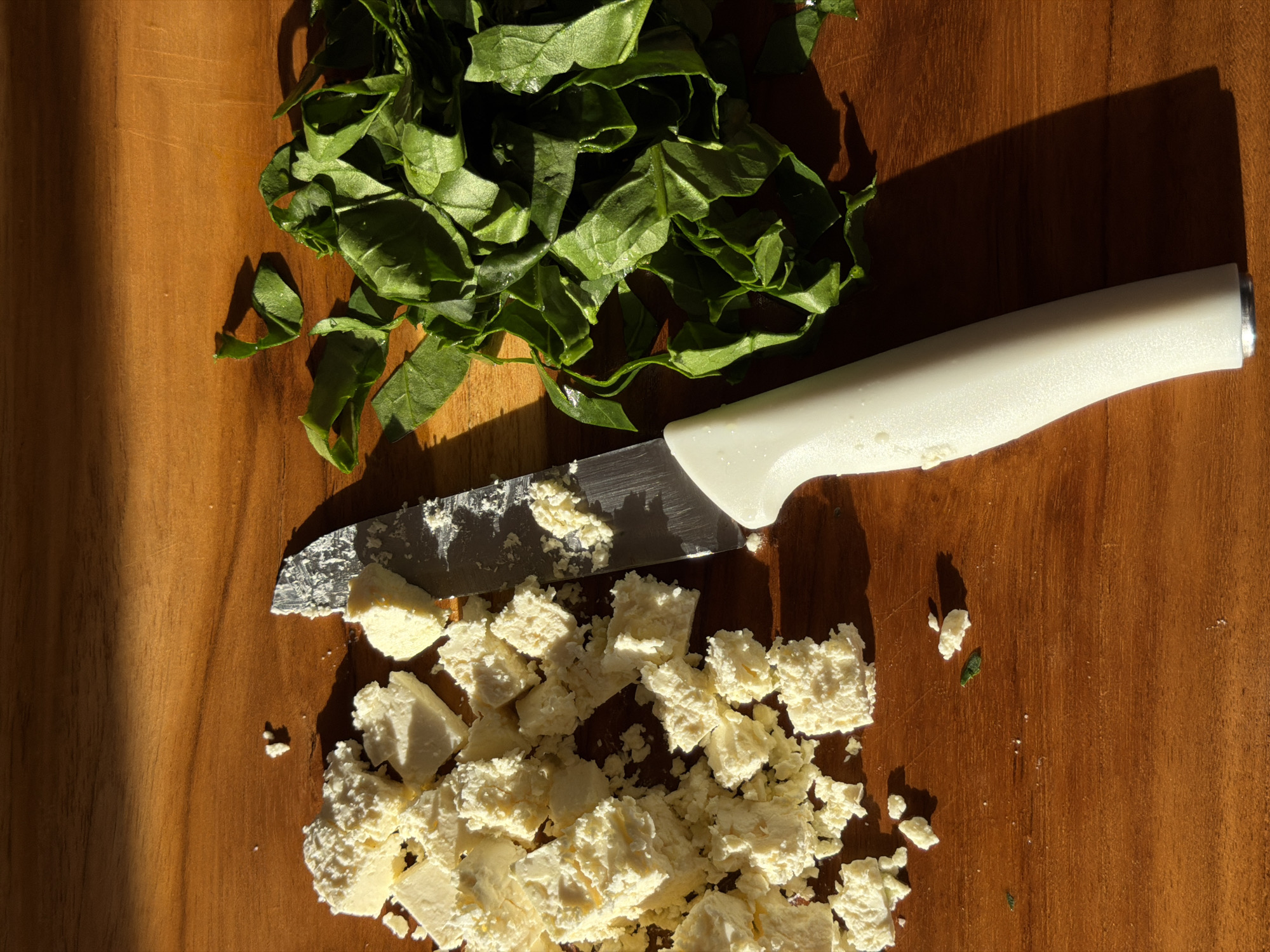 Fresh green salad prep underway in a Mengwi kitchen