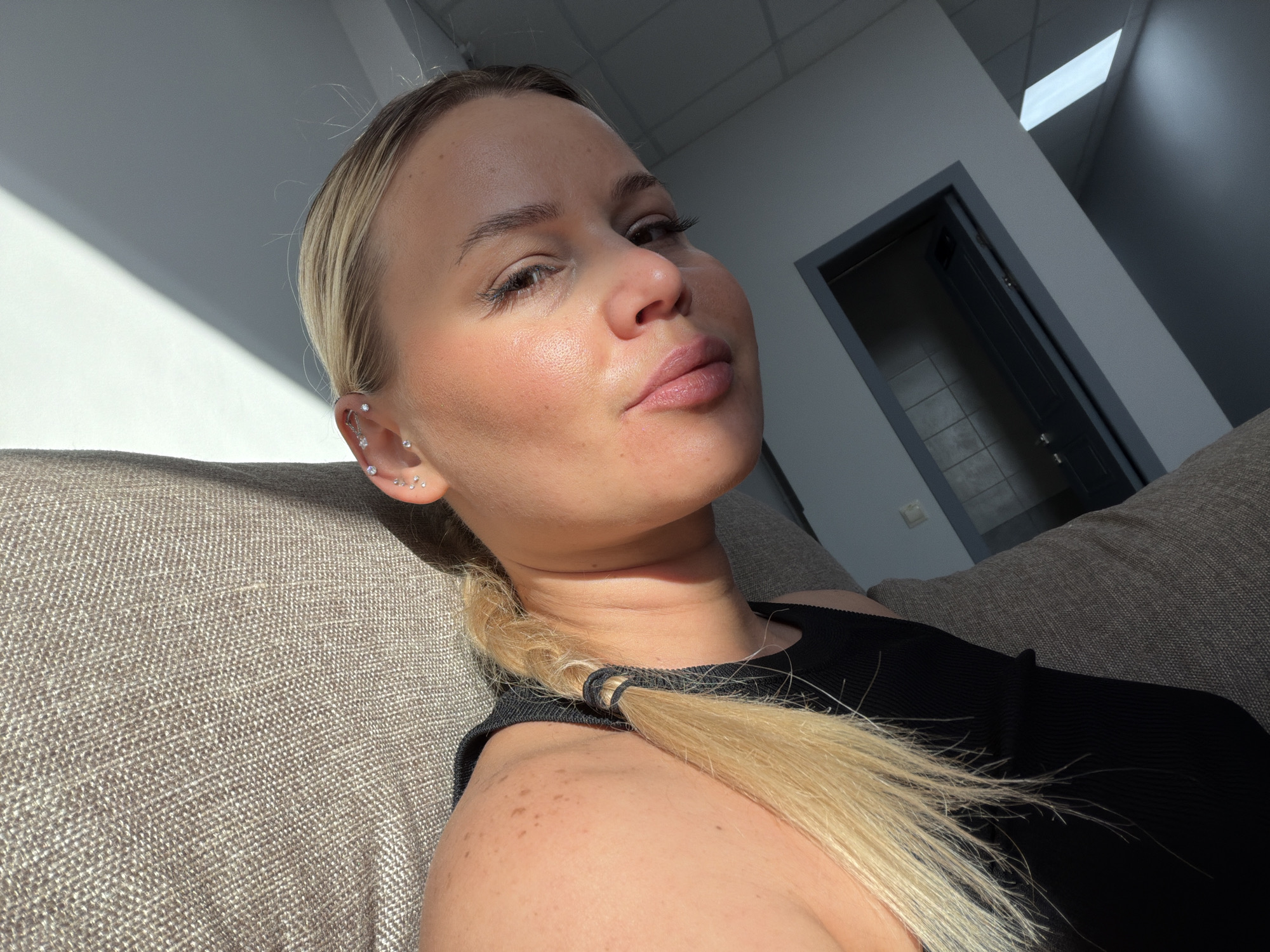 Woman documents morning routine with selfies in Sarapul apartment
