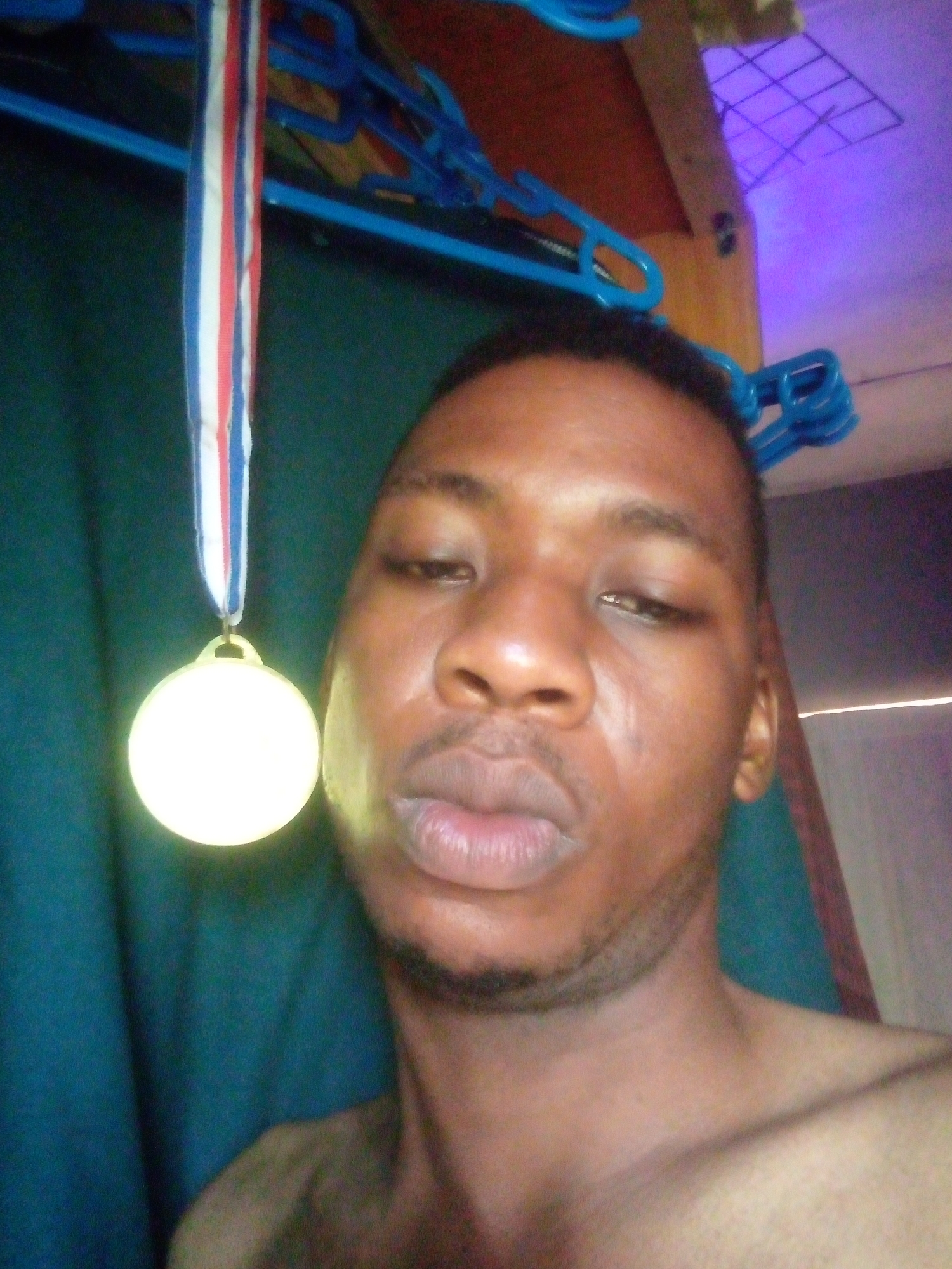 Man takes medal selfies in Ikorodu, Nigeria