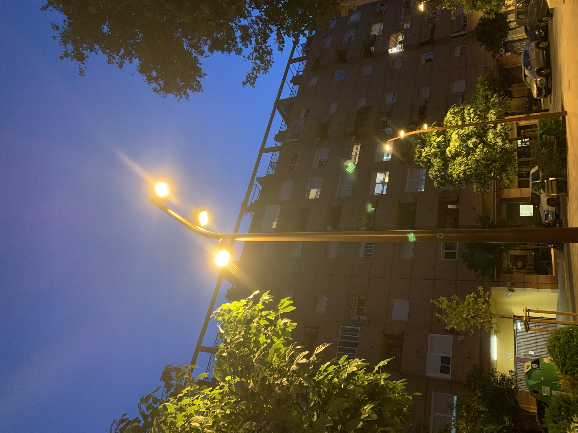 Valencia street corner at dusk, transitioning into night