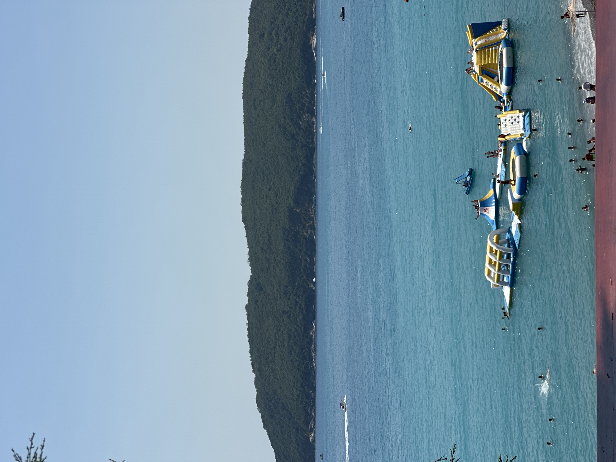 Boreti beach in full summer swing — crowds, parasails, Adriatic views