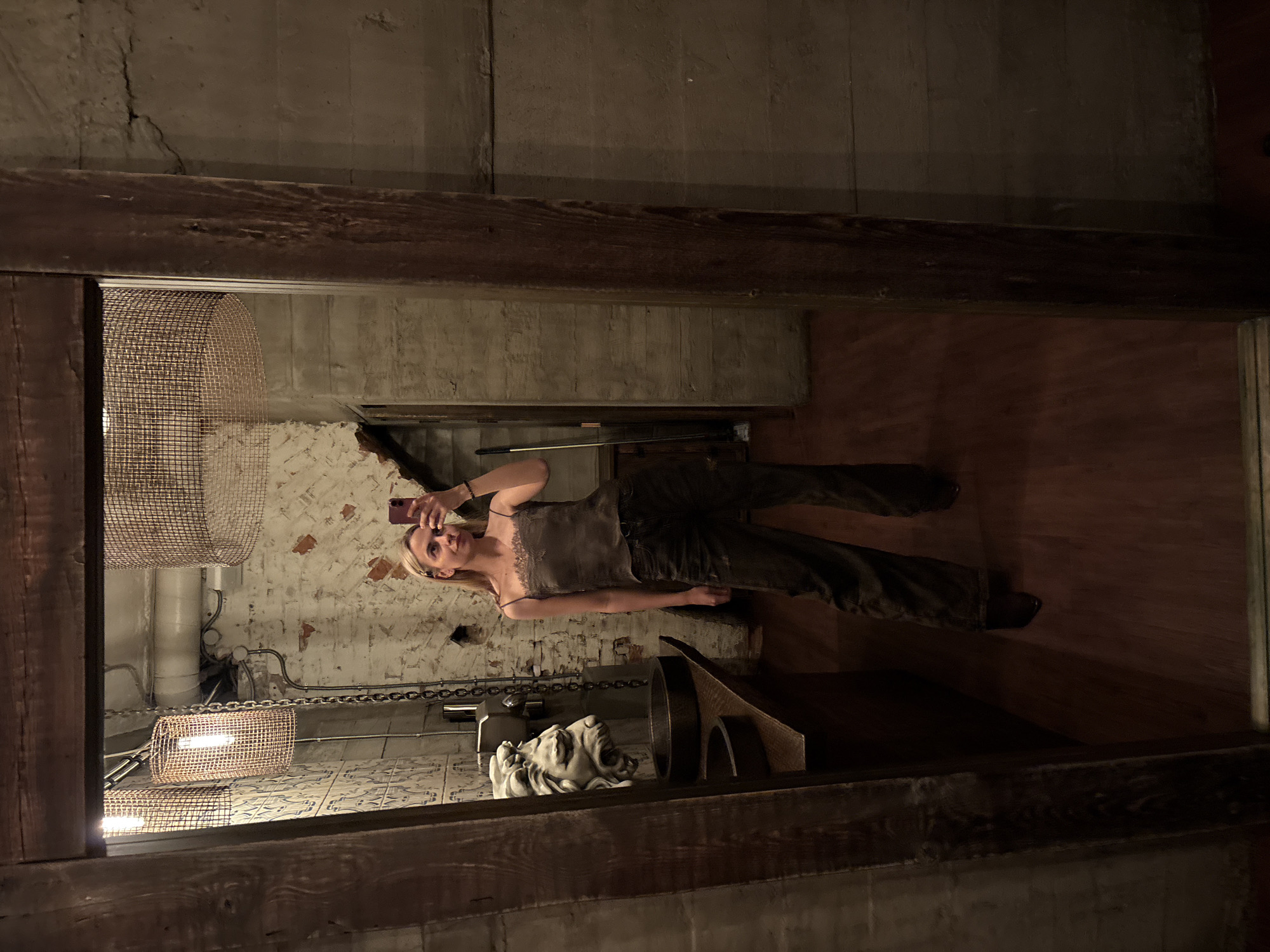 Woman takes selfie in basement room in Krasnoyarsk