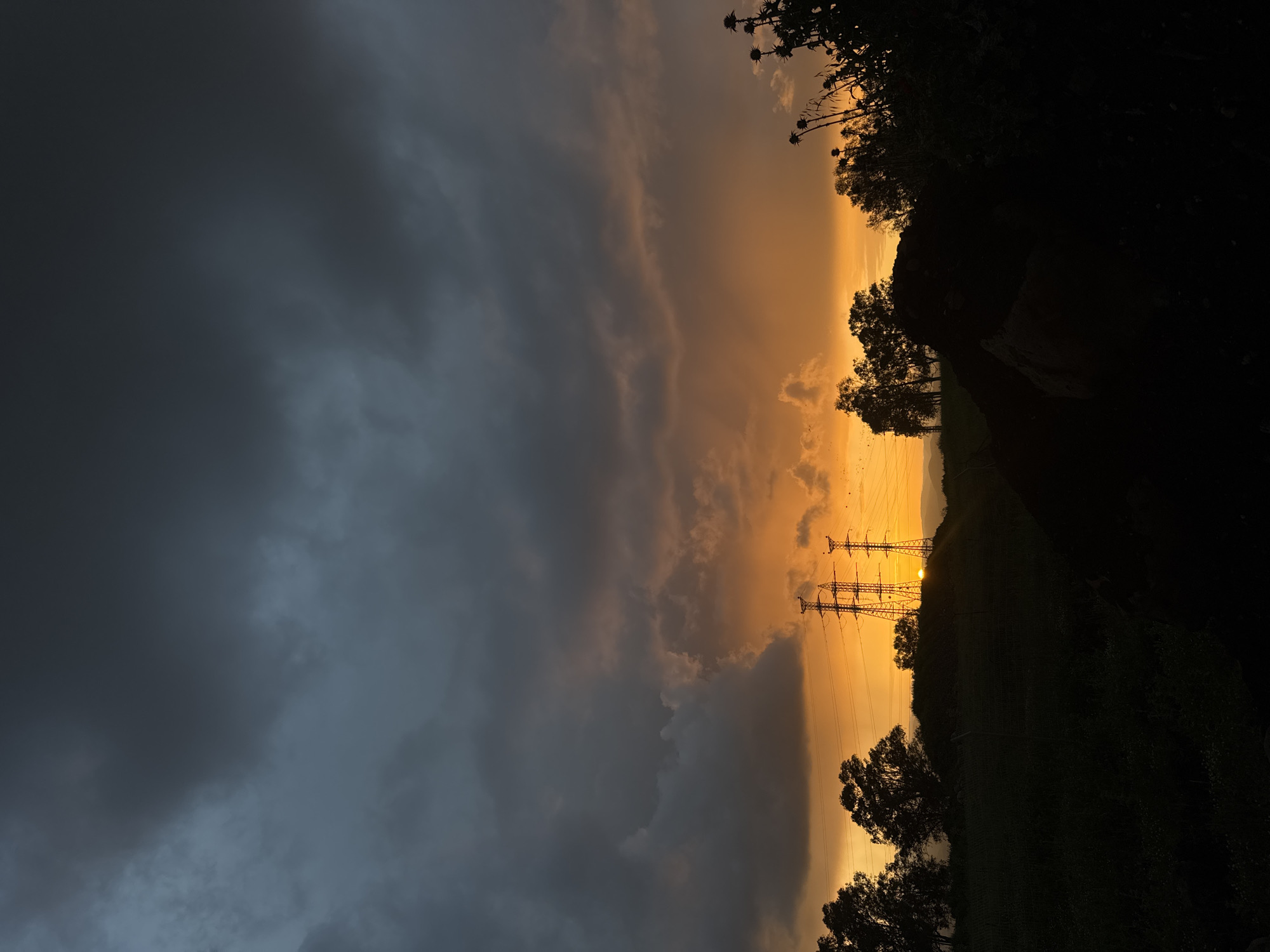 Dramatic sunset with contrasting storm clouds observed near Al Jizah