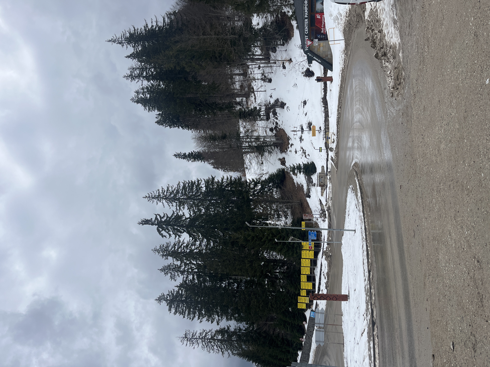 Snow patches dot roadside slopes in Stoikite, Bulgaria