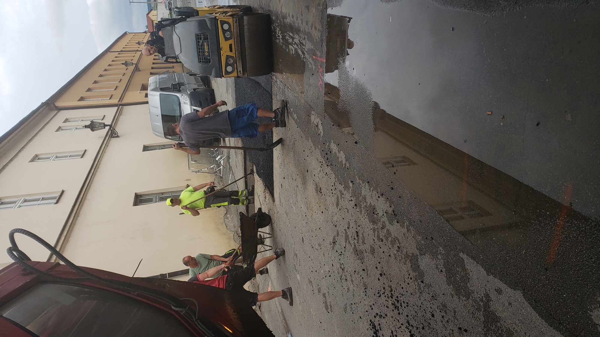 Road crews conduct paving work in Prešov, Slovakia