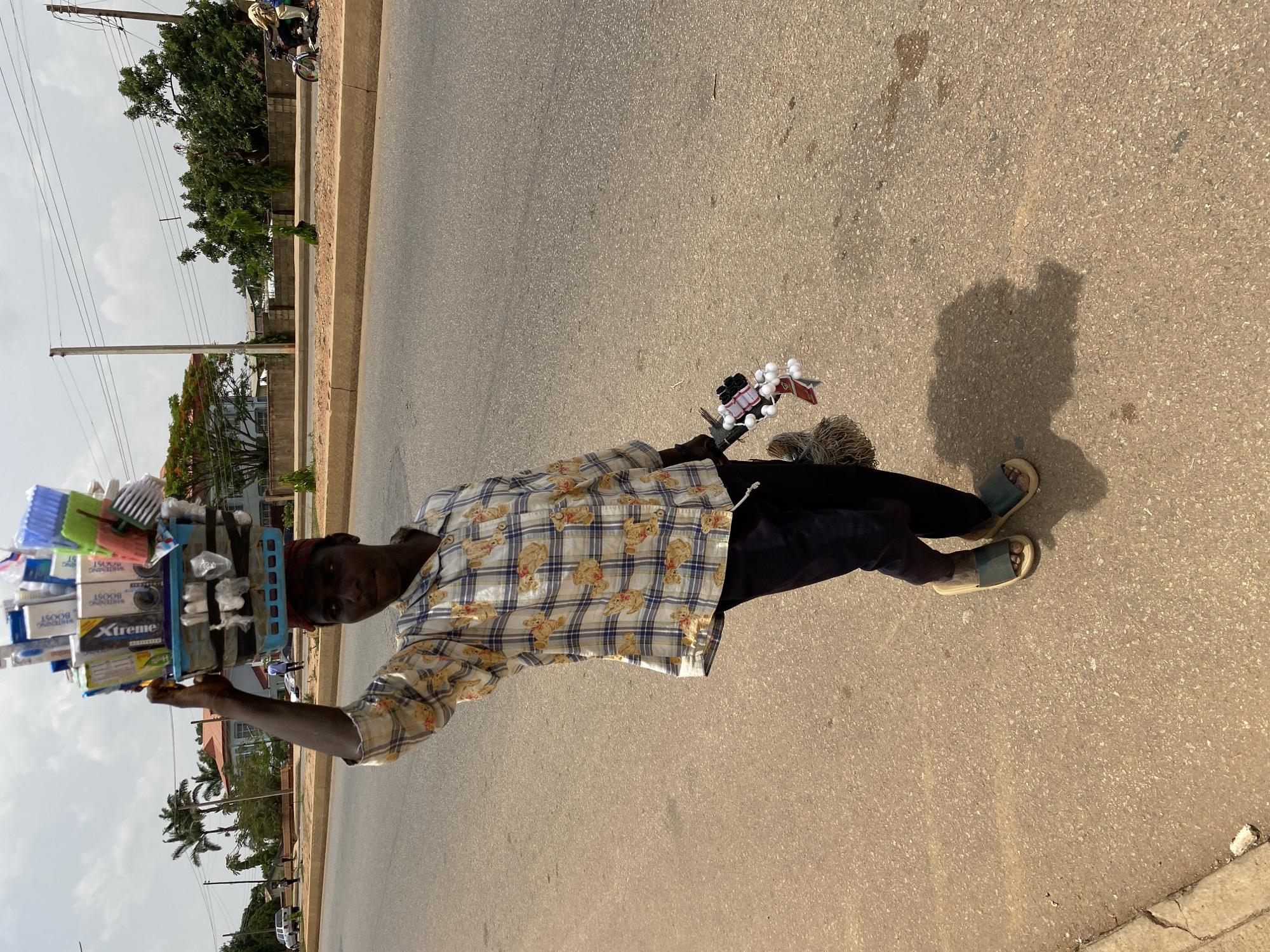 Daily life unfolds in Bukuru, Nigeria streets and fields