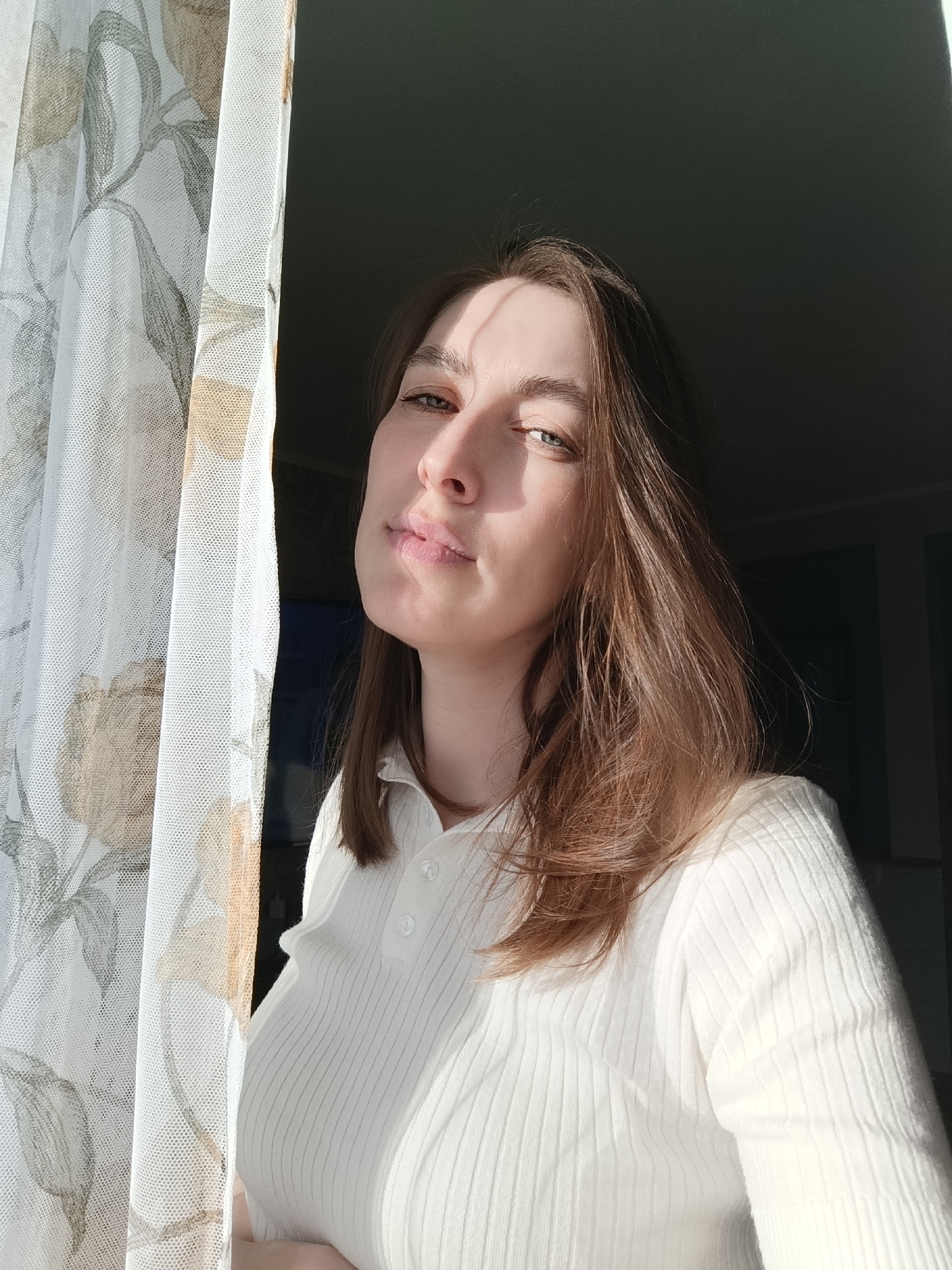 Woman photographed in sunlit indoor spaces in Фоки, Russia