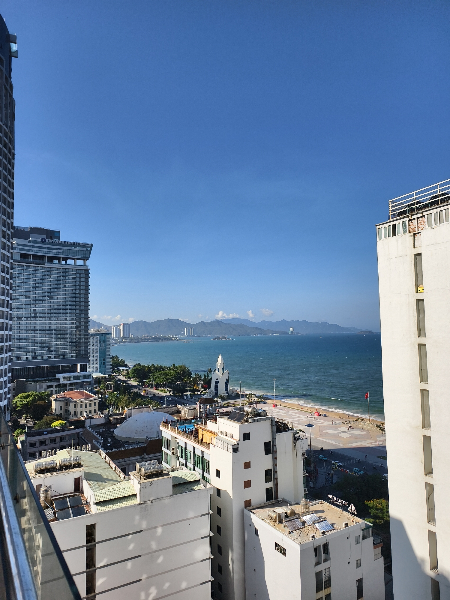 Coastal Southeast Asian cityscape photographed from elevated viewpoint