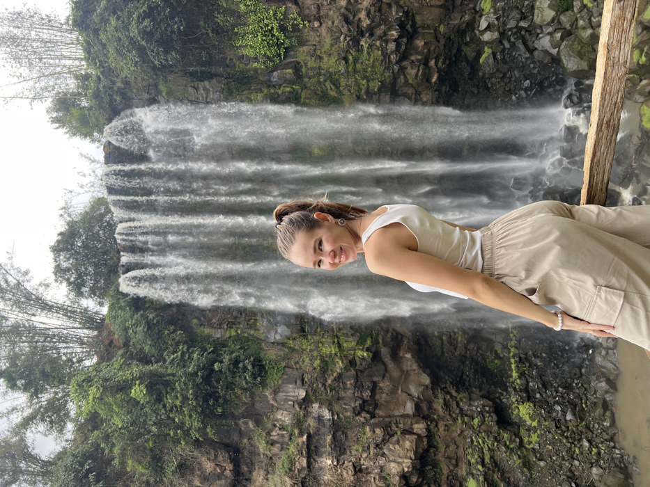 Woman photographed at waterfall in Hòa Bình Vietnam