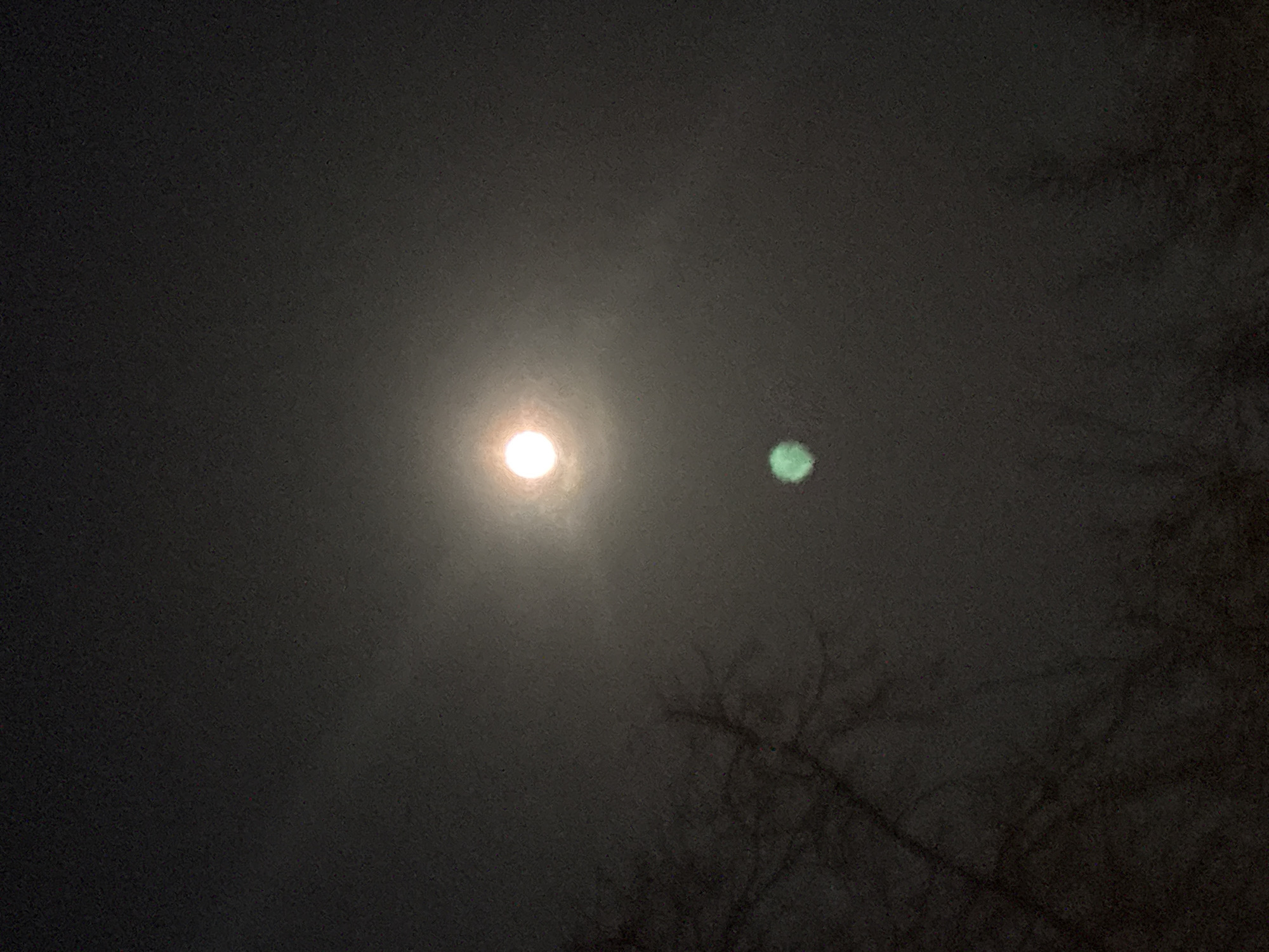 Night sky with moon and second light source observed