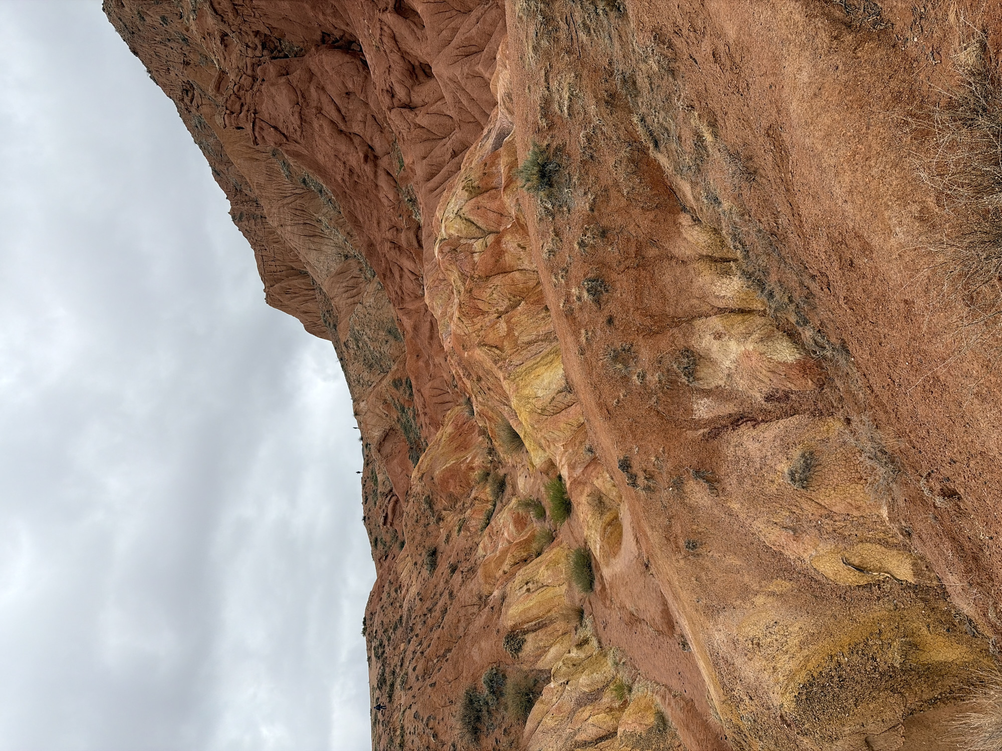 Tourist documents Fairytale Canyon rock formations in Tosor, Kyrgyzstan