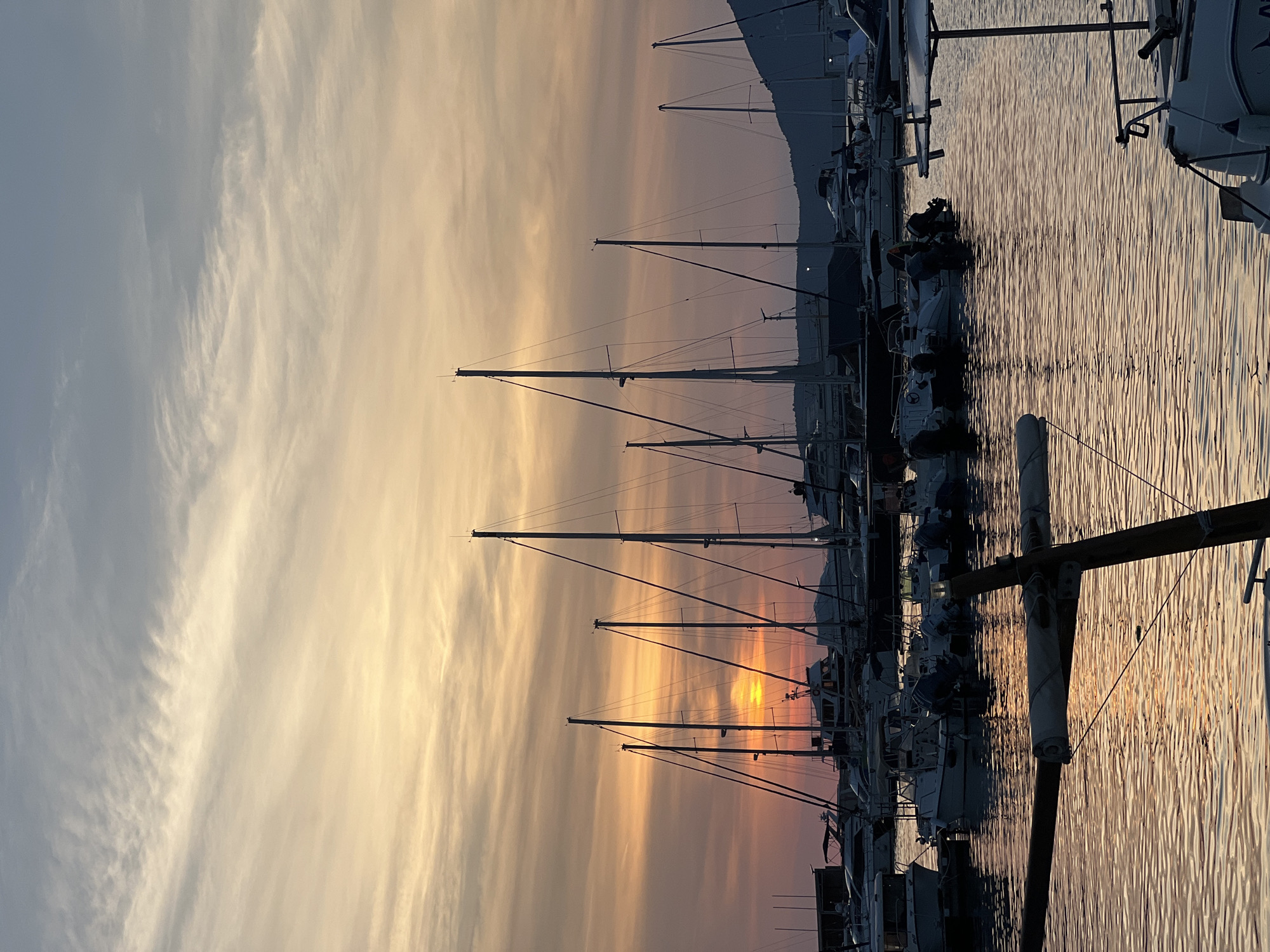 Sunset over Bar's Adriatic harbor, cruise ship offshore