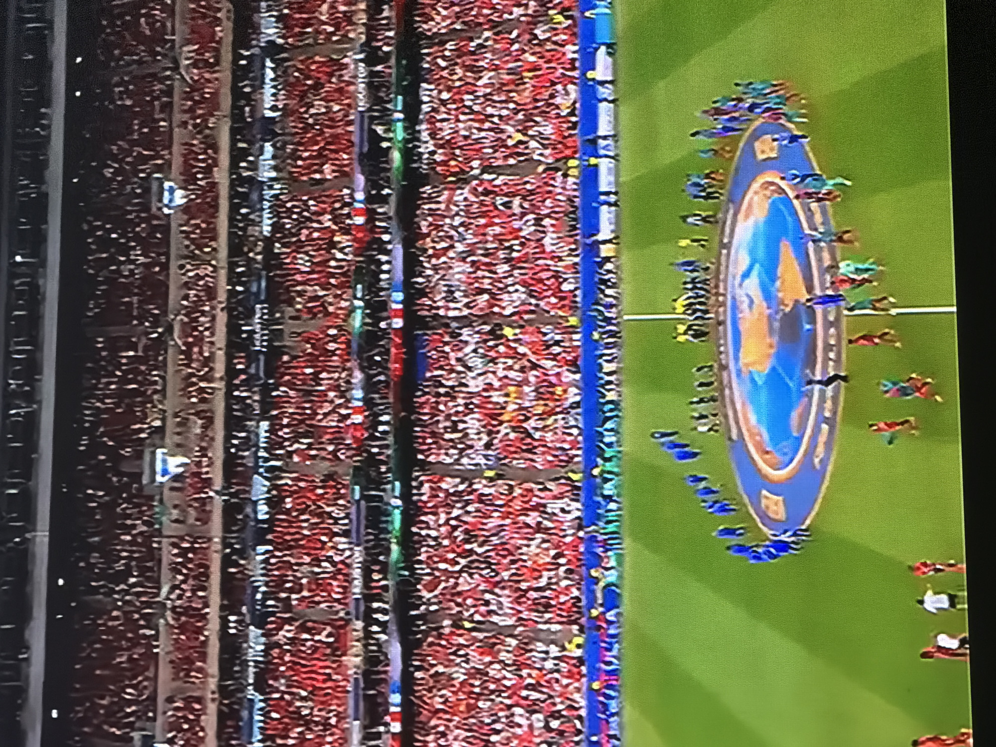 Packed stadium in Yangiiul filled with red-clad crowd