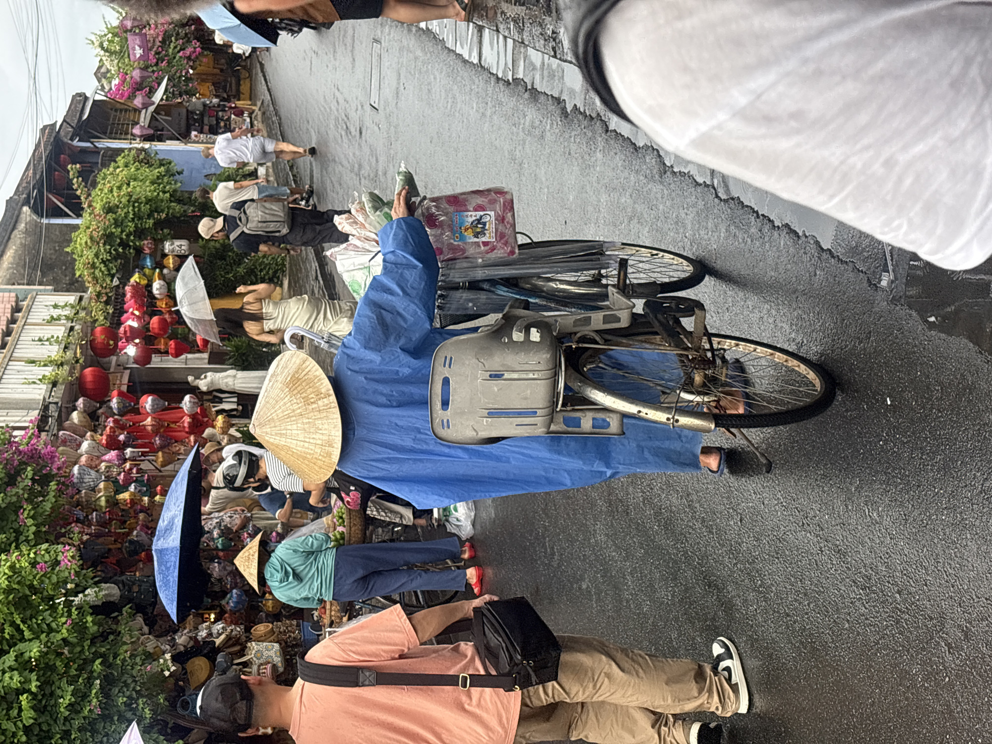 Rainy day street life in Hoi An's Old Town