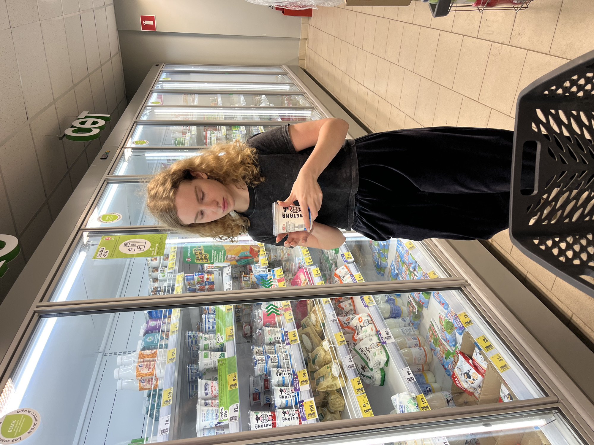 Woman shops for groceries at Vasilyevo supermarket