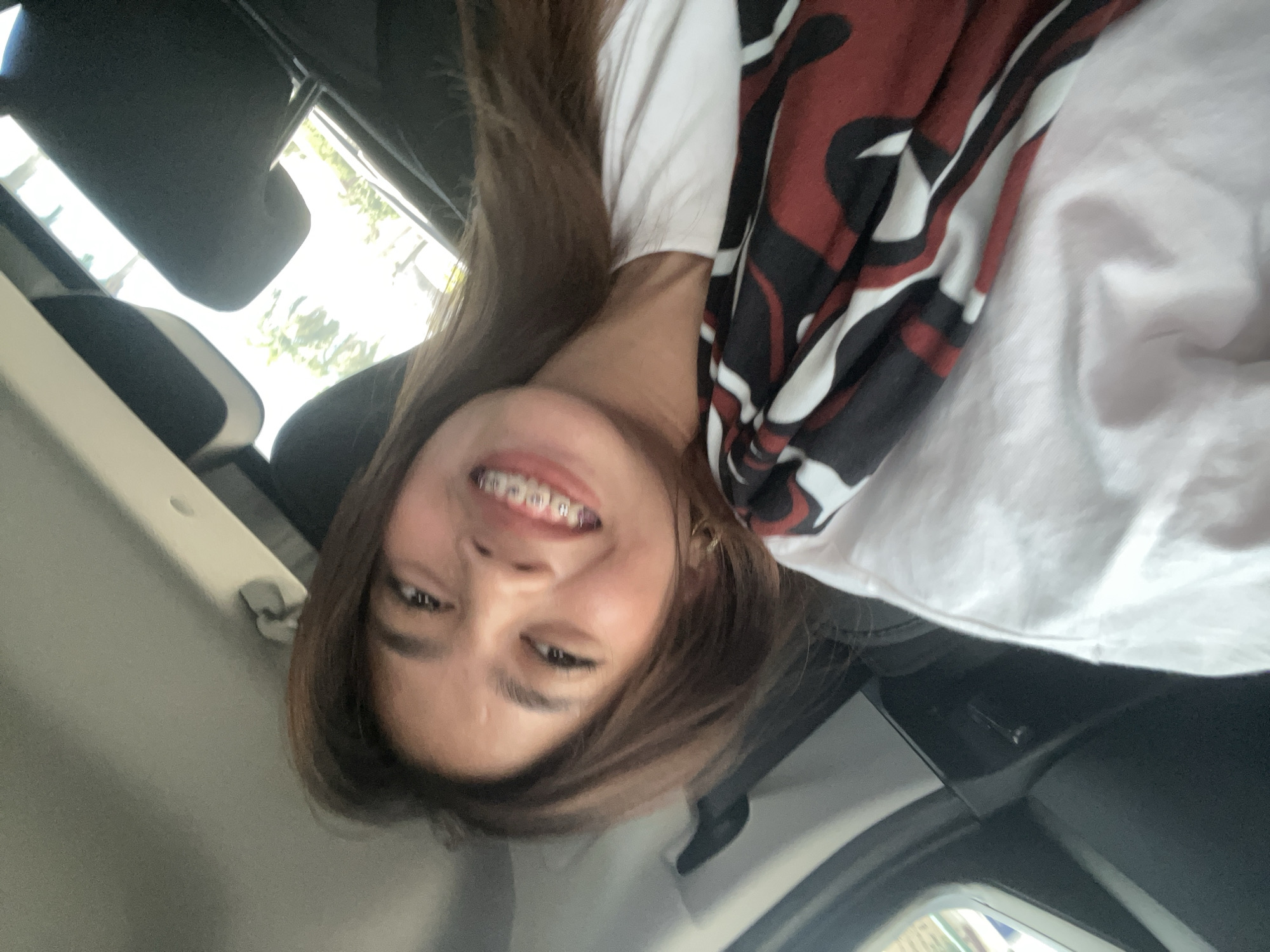 Smiling portrait in Tagum, Philippines, patterned scarf.