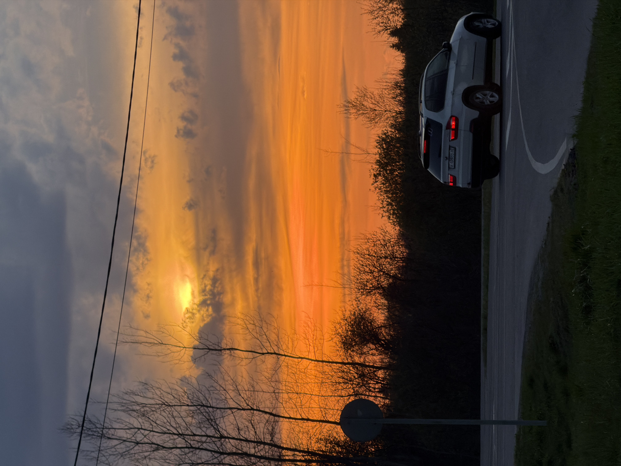 Sunset witnessed near road intersection in Ostrov, Russia