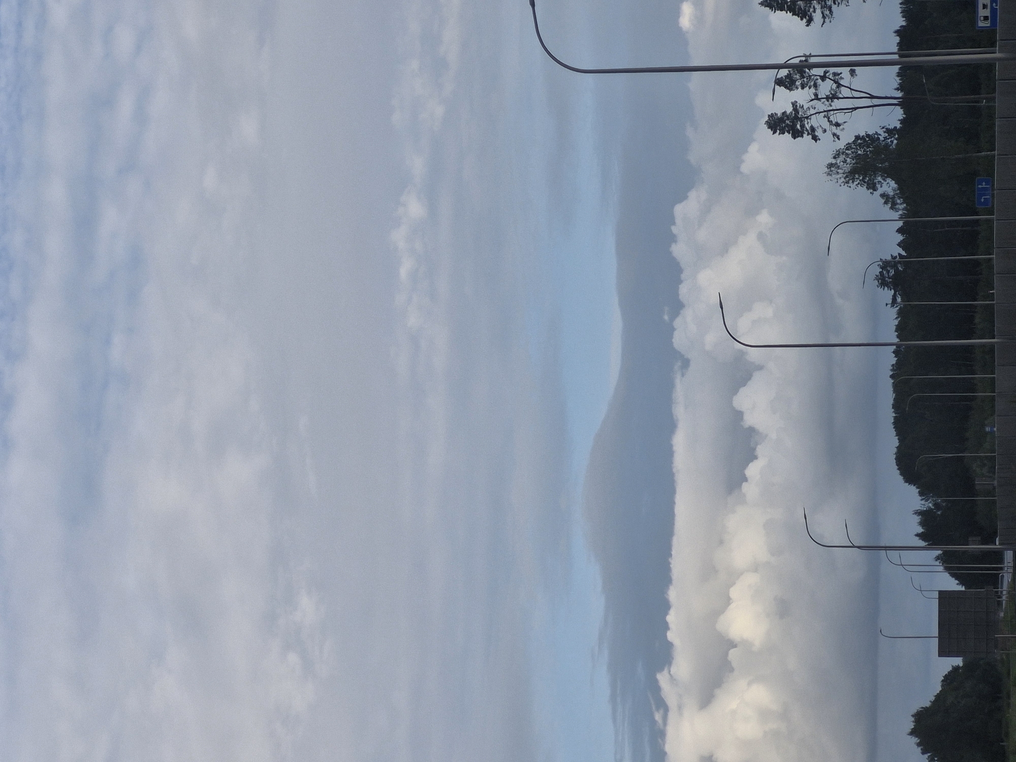 Stormy skies and quiet roadsides near Jenči, Latvia